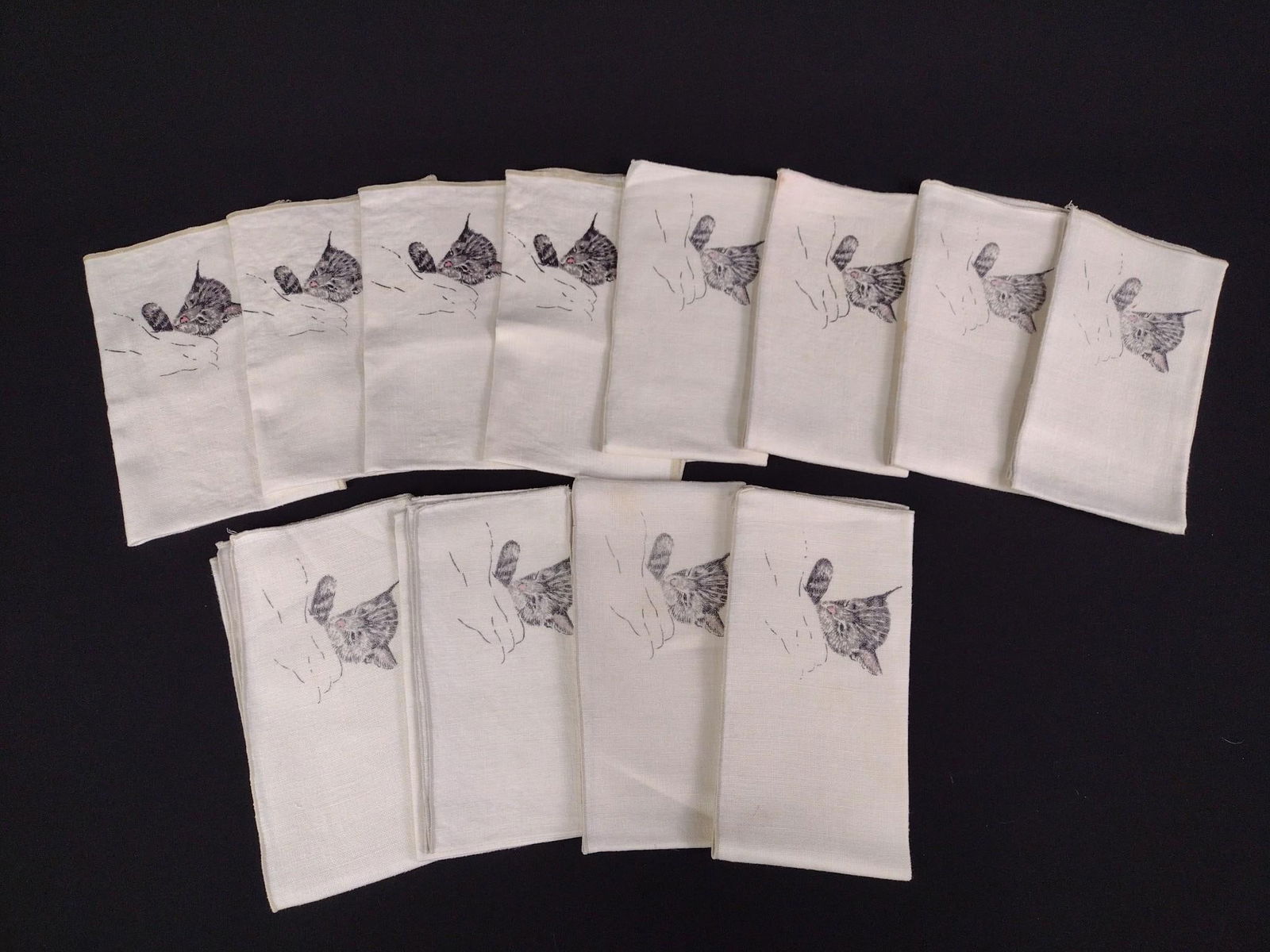 12 Chesapeake and Ohio "Chessie" Cat Linen Napkins: Overall good condition, with some discoloration.
