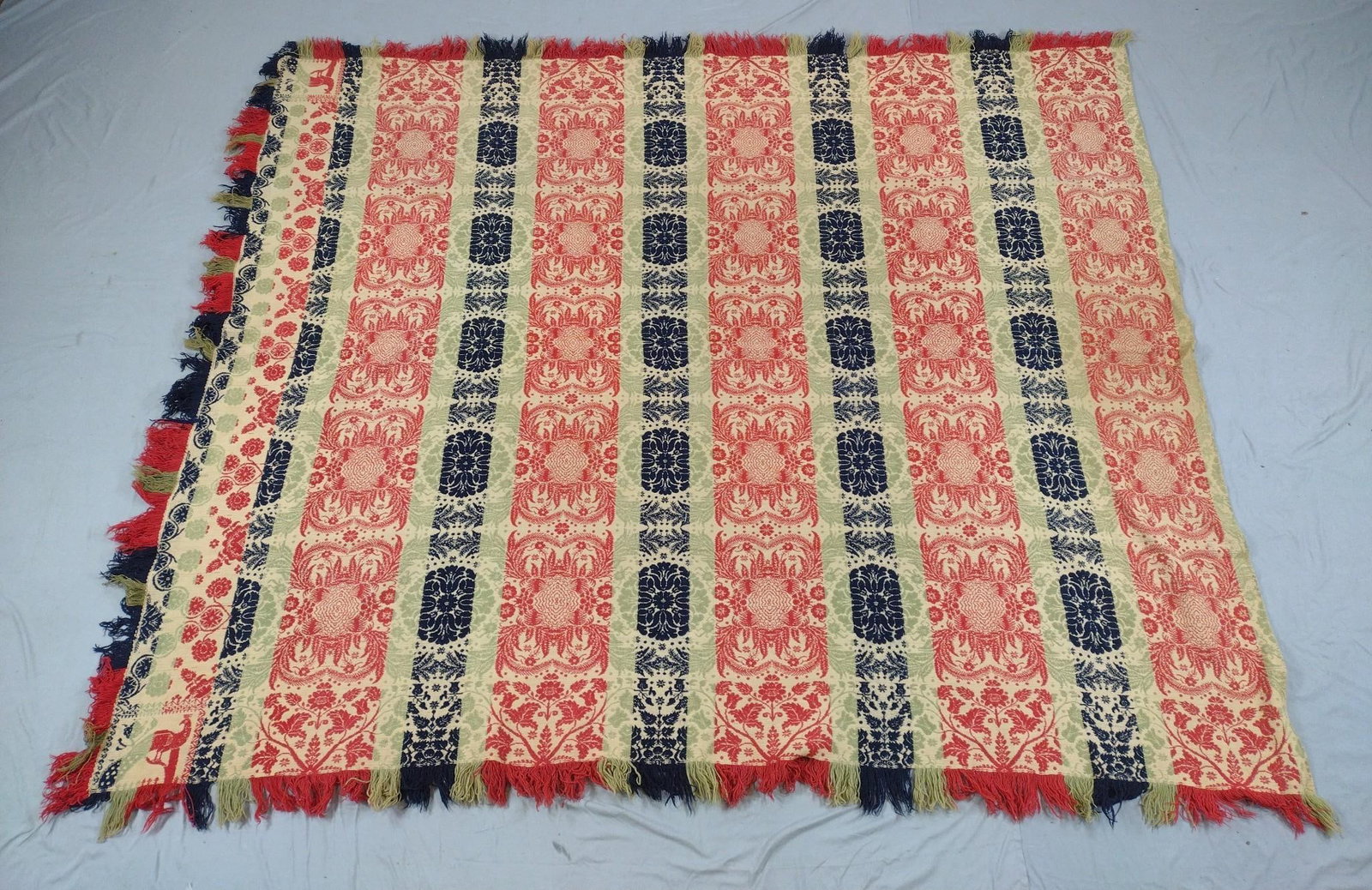 Vintage Red Blue and Green Coverlet: Unmarked. Overall good condition. 90" long X 75" wide.
