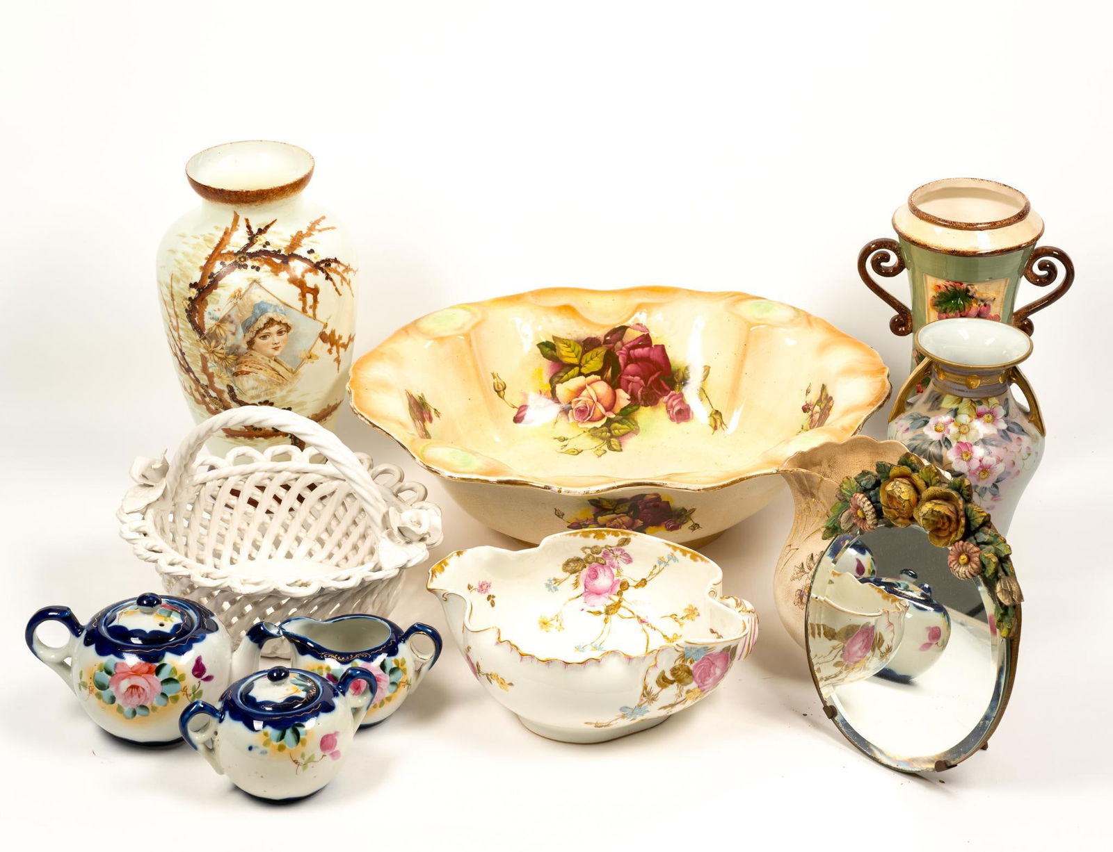 Lot of Decorative Items: Includes vases, mirror, pitchers, and more. Blue and white tea set is marked as "Made in Japan." Capodimonte style basket marked as 'Made in Portugal." Floral vase is marked "Imperial Nippon Hand Pain