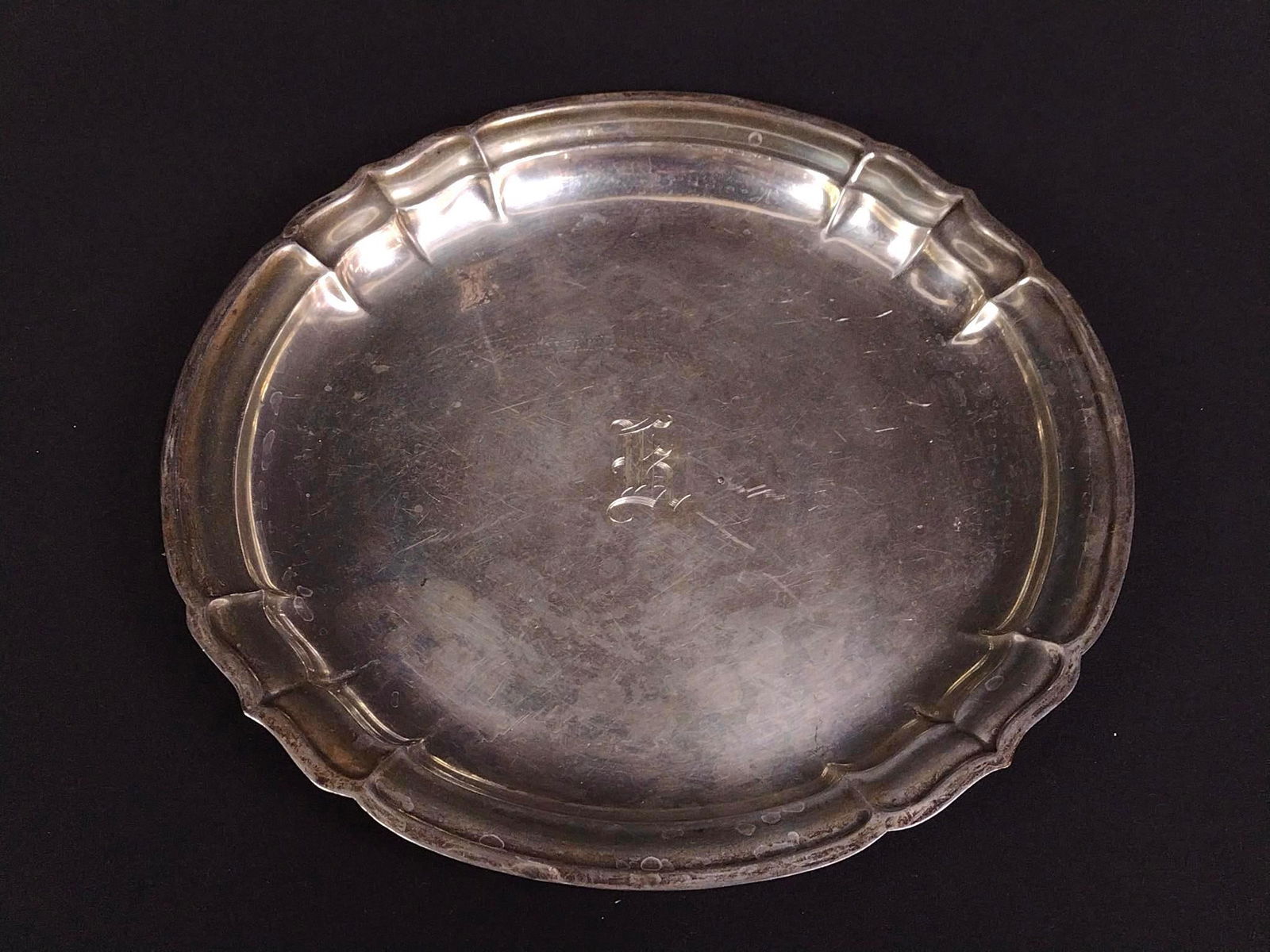 Reed and Barton Sterling Silver Plate: 12" in diameter. 17.235 ozt. PROVENANCE: From Kunkel Estate in Harrisburg, PA.