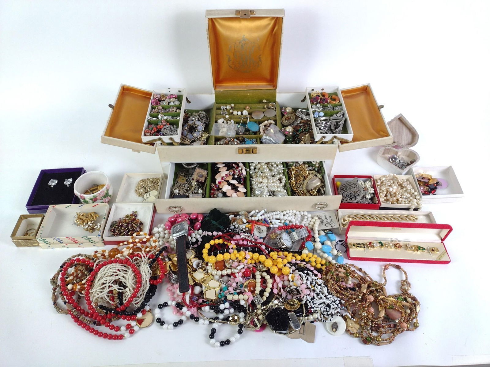 Costume Jewelry: Includes Joan Rivers and more. Types include necklaces, pins, earrings, bracelets, watches, and more. Also comes with jewelry box, poor condition.