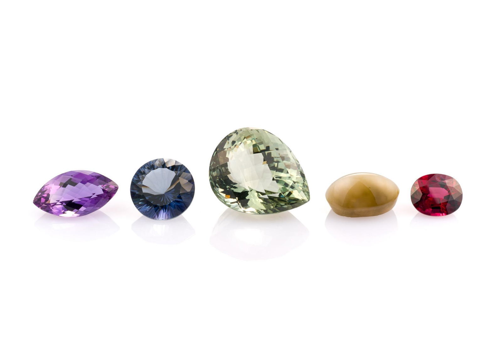 5 Unmounted Gemstones: Includes (1) Topaz, round, 11 carats, VVS, color treated; (2) Amethyst, pear, 38.62 carat, VVS, natural; (3) Natural Chatoyancy, oval cabochon, 13.35 carats, opaque, unheated; (4) Rhodolite Garnet, ov