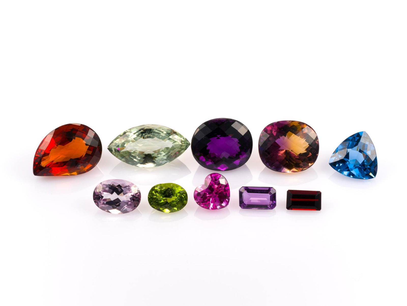 10 Unmounted Gemstones: Includes (1) Topaz, heart, 14.92 carat, IF, heated; (2) Topaz, trilliant facet, 23.53 carats, clean, heated; (3) Ametrine, oval, 35.33 carat, VVS, unheated; (4) Amethyst, marquise, 38.1 carat, VVS, na