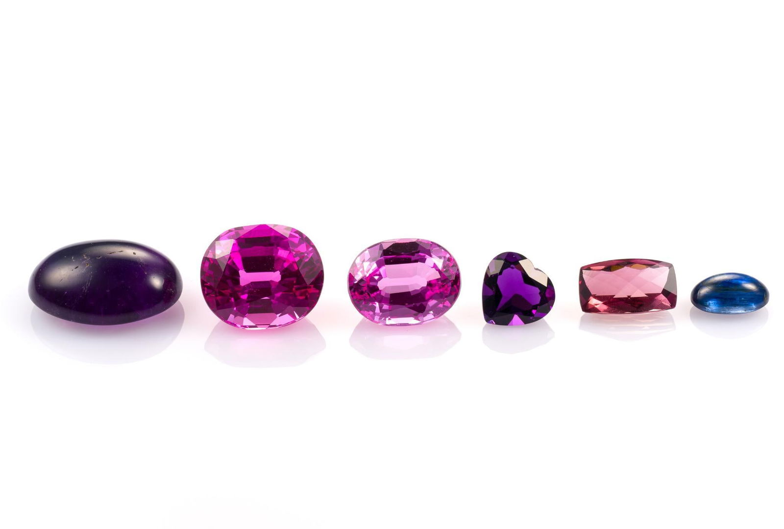 6 Unmounted Gemstones: Includes (1) Amethyst, oval cabochon, 30.15 carats, translucent, unheated; (2) Topaz, oval, 30.64 carats, VVS1, enhanced; (3) Topaz, oval, 20.45 carats, IF, heated; (4) Tourmaline, cushion cut, 7.22 c