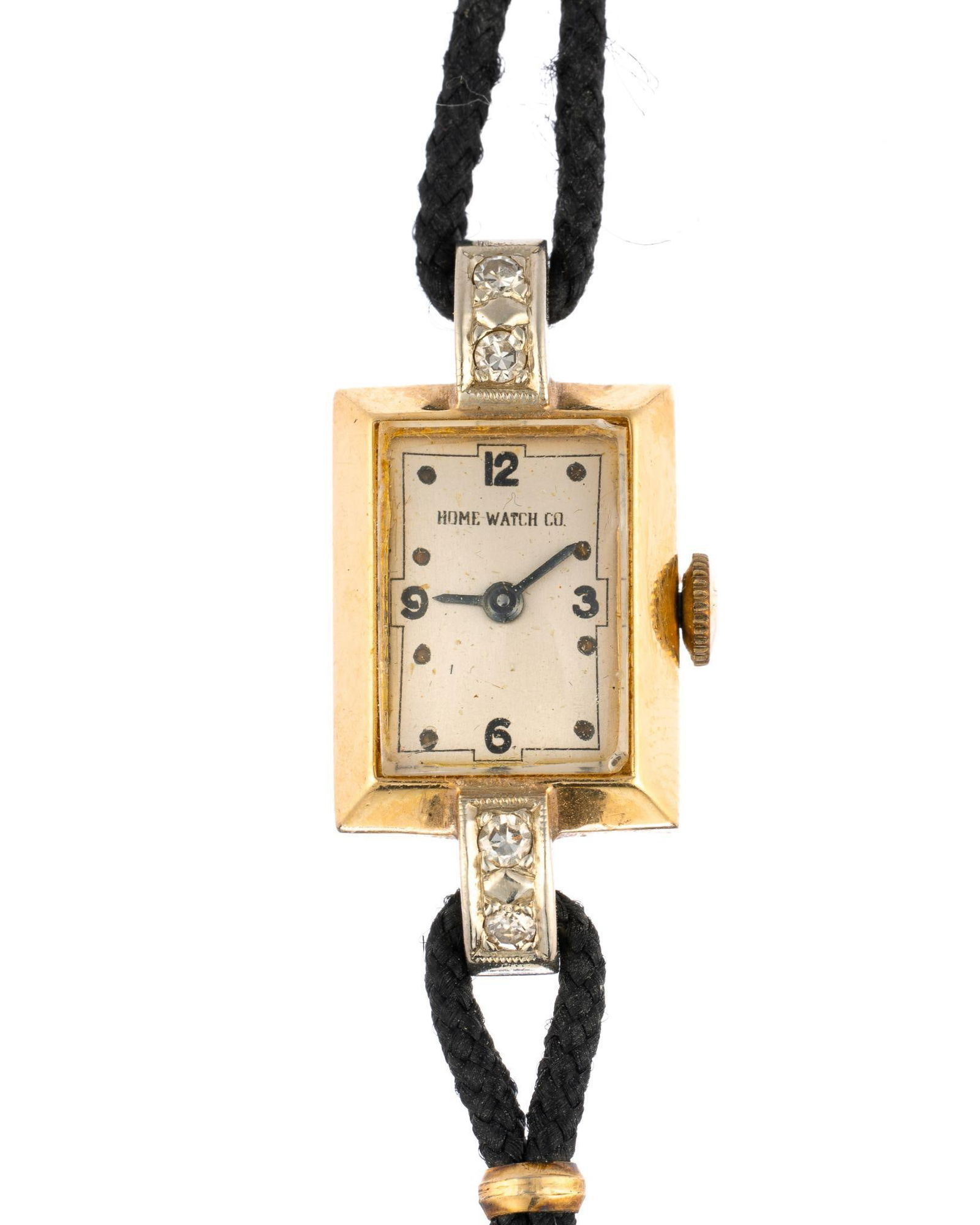 14K Gold Cord Watch: Home Watch Company cord watch in yellow gold with small diamonds. The case width is 14 mm. The watch sets, runs, keeps time, not accuracy checked. The case weight is approximately 5.5 grams.