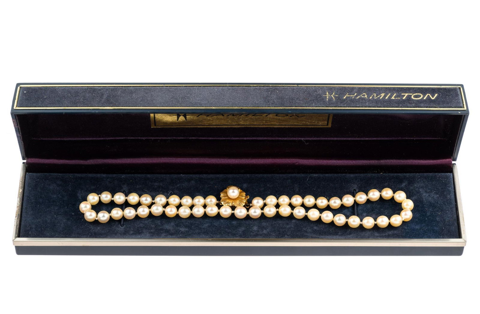 Pearl Necklace With 14K Gold Clasp: A 15" cultured pearl necklace with 14k yellow gold floral clasp. The pearls are approximately 7 mm.