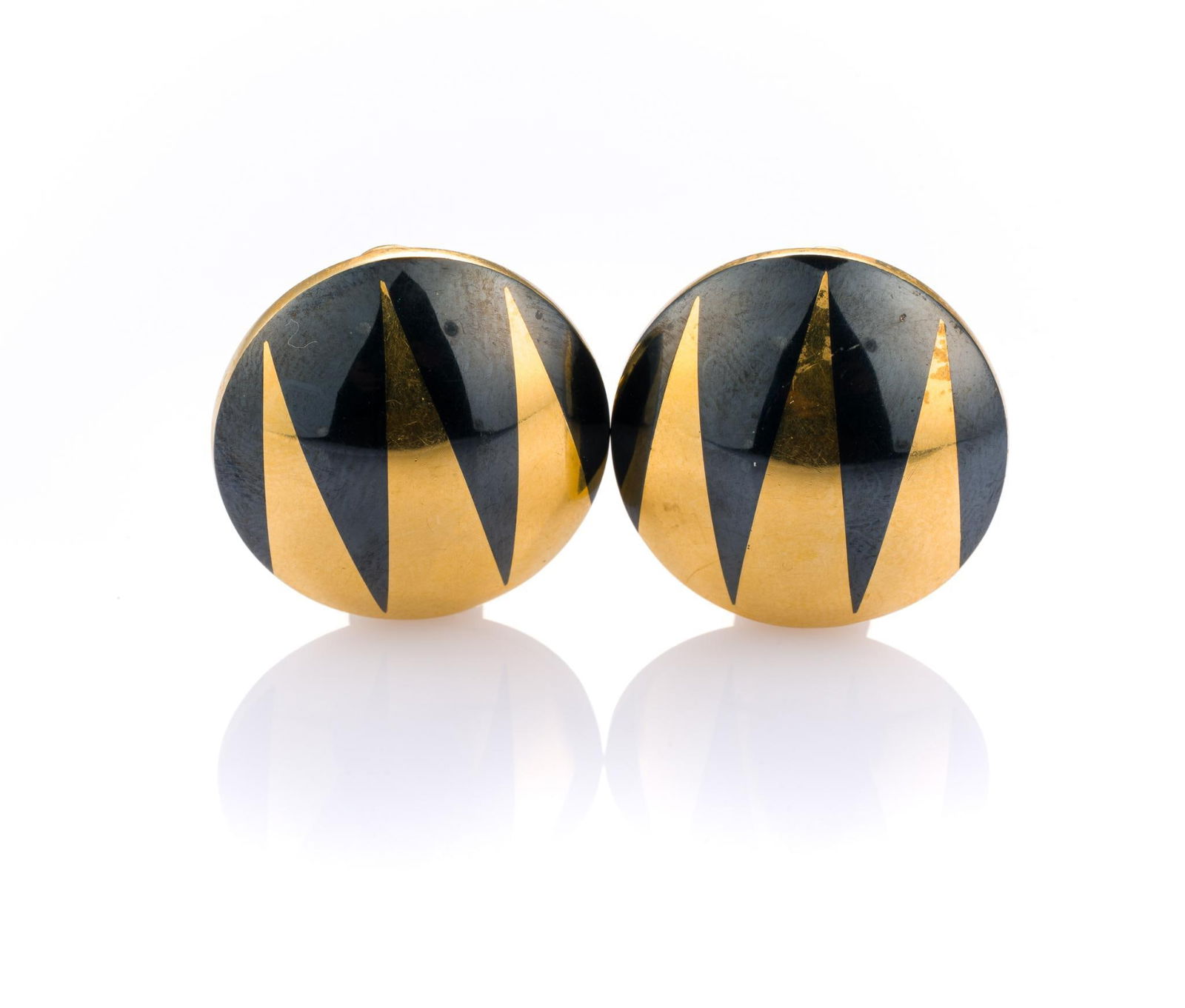 18K Gold Earrings: Button earrings with post and clip backs in 7/8" diameter with black enamel designs. The earrings weigh 11.3 grams.