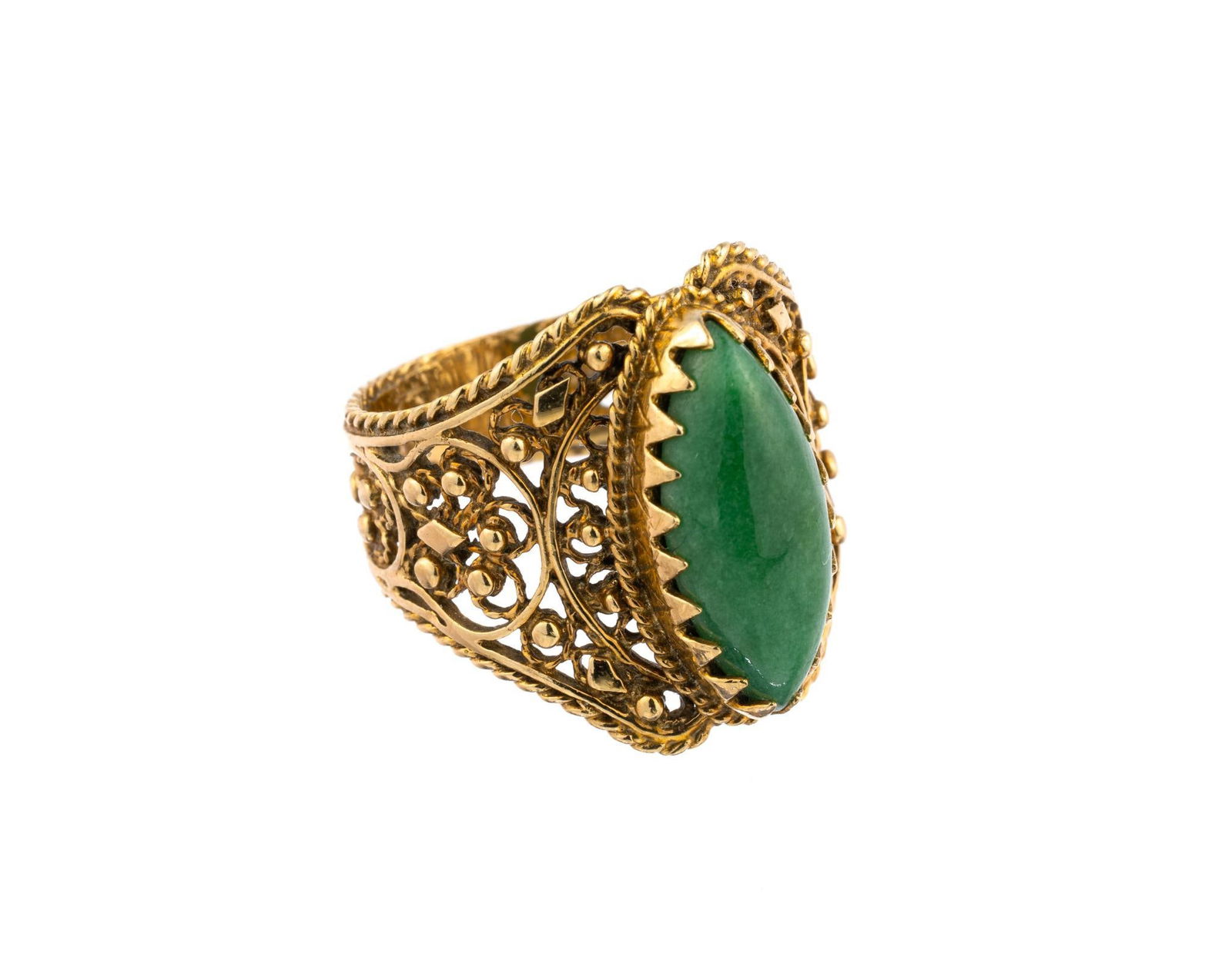 14K Gold And Jade Ring: A size 9 ring with open fifgree work and a marquise jade cabochon. The weight is 8.2 grams.