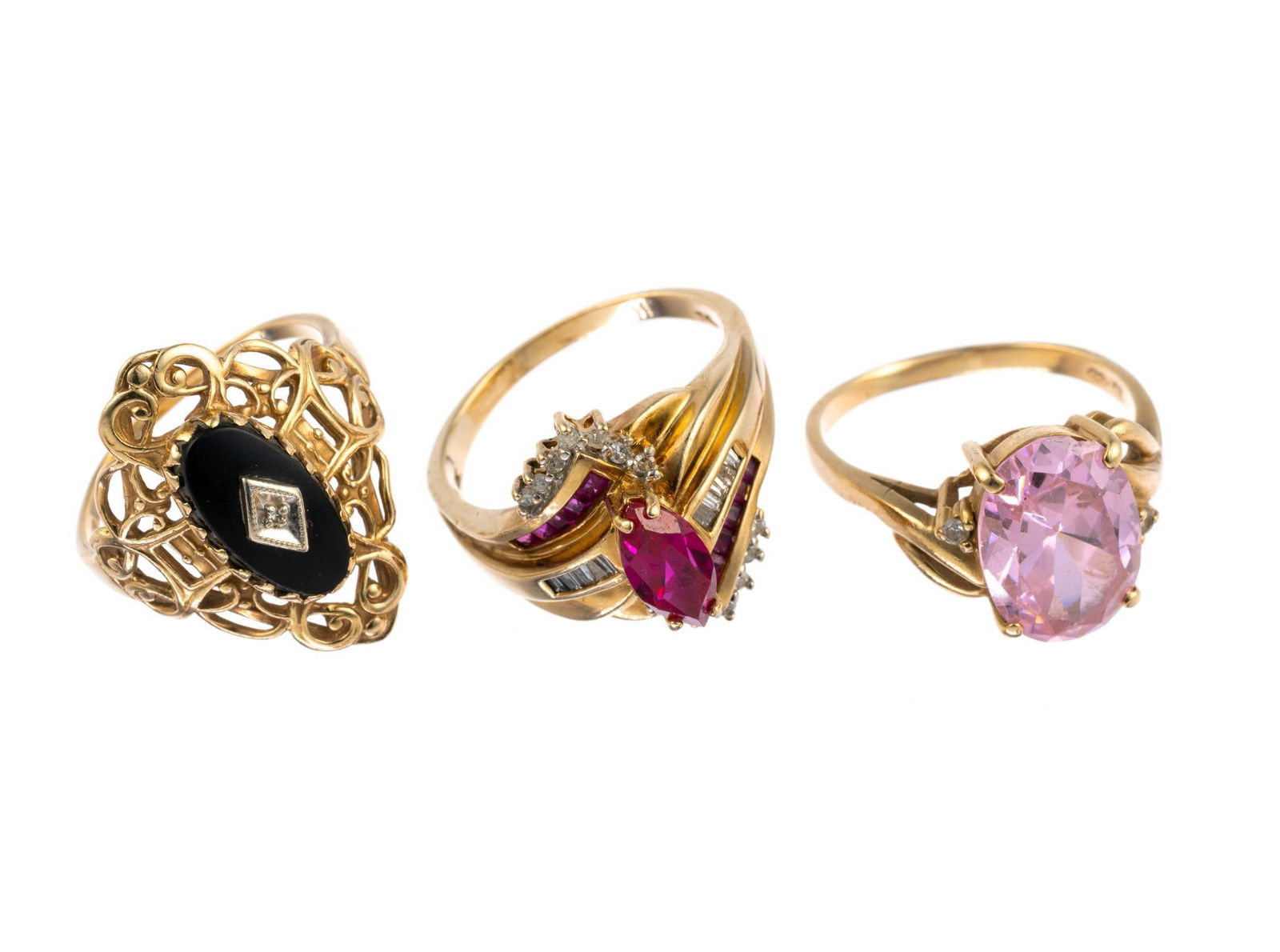 Three 10K Gold Gemstone Rings: The rings are sized 9 to 10 and include an antique onyx and filigree ring and a morganite gemstone ring. Total weight is 15.7 grams.