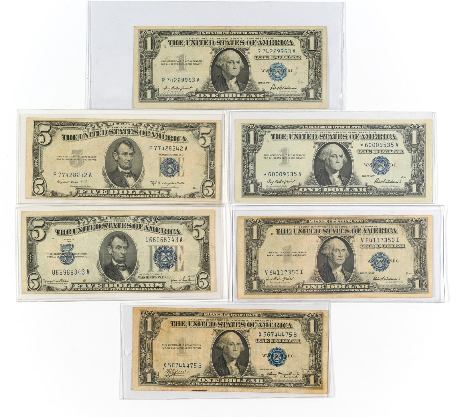 Silver Certificate Five And One Dollar Bills: The lot includes two $5 and four $1 silver certificates from 1934 to 1957. Excellent condition generally with creases from past folding, light to medium circulation wear, no losses or damage.