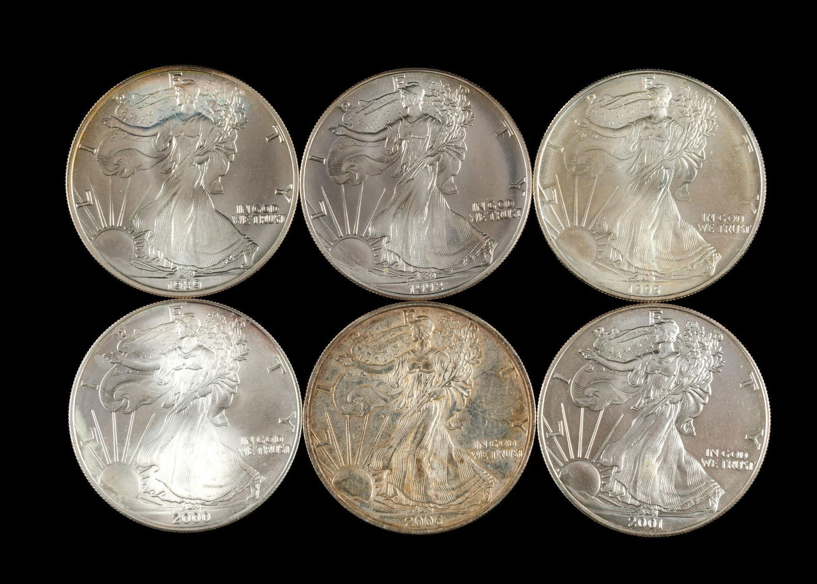 Six Silver American Eagle Dollars: The years are 1989, 1992, 1995, 2000, 2001, 2006.