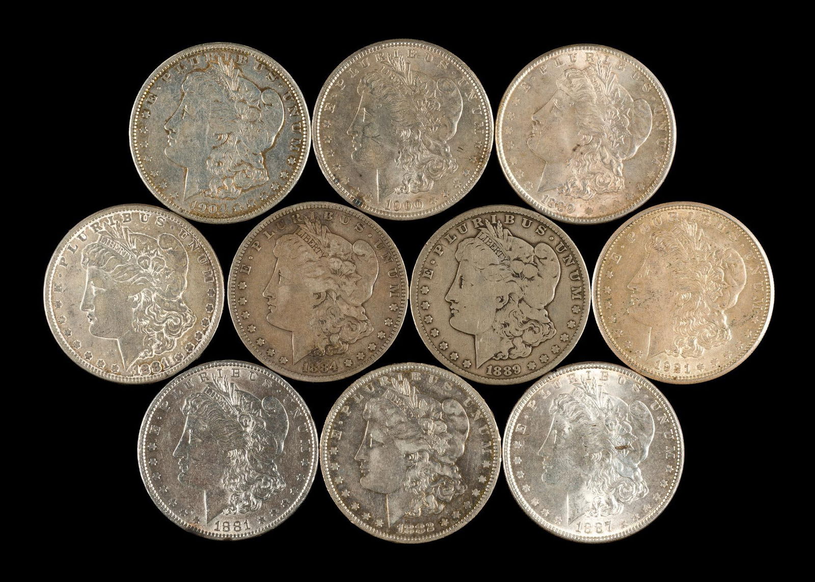 Ten Morgan Silver Dollars.: The group contains a few better grade coins.