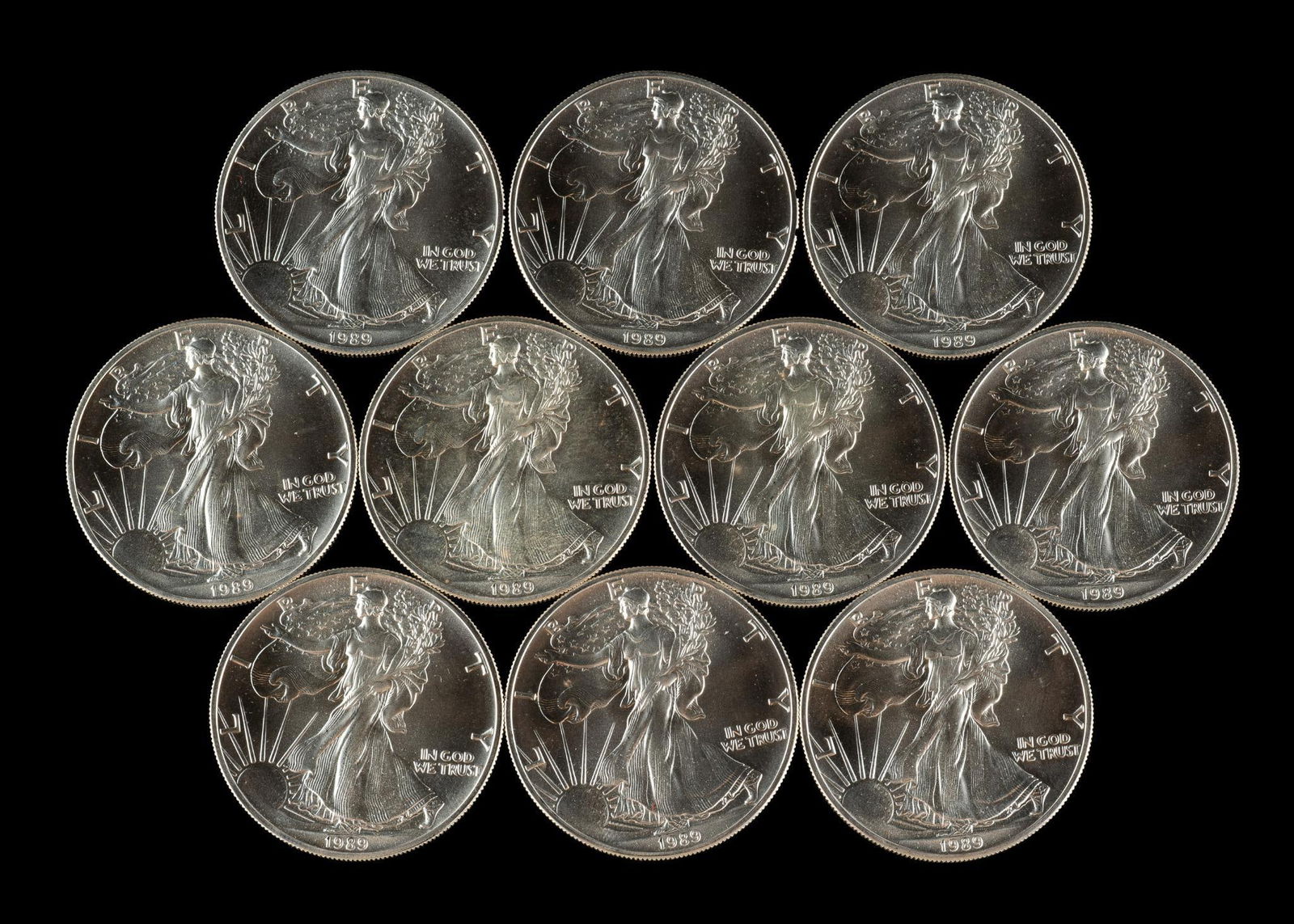 Ten American Silver Eagle Coins: 1989 uncirculated American Silver Eagles, one ounce pure silver each.