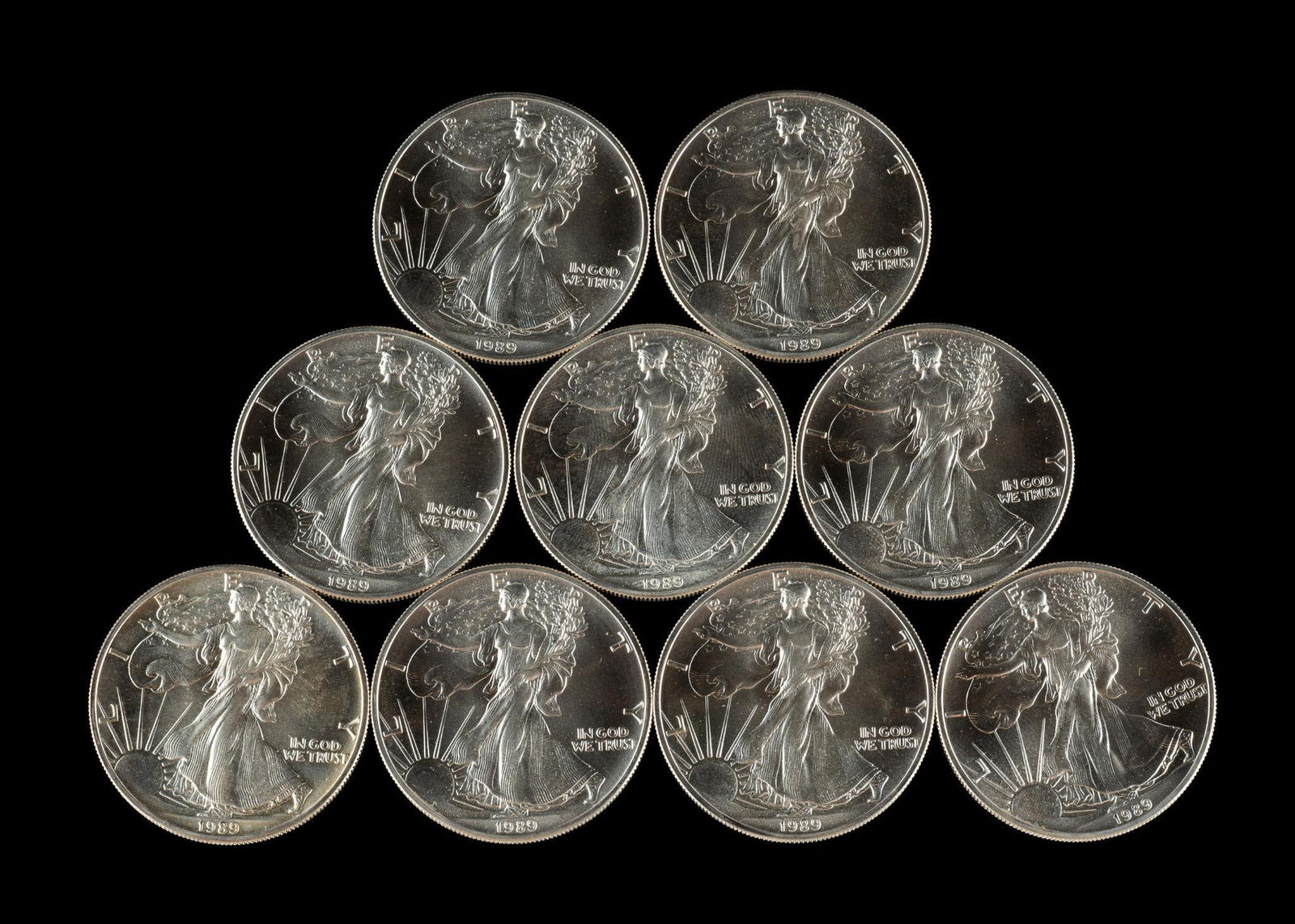Nine American Silver Eagle Coins: 1989 uncirculated American Silver Eagles, one ounce pure silver each.