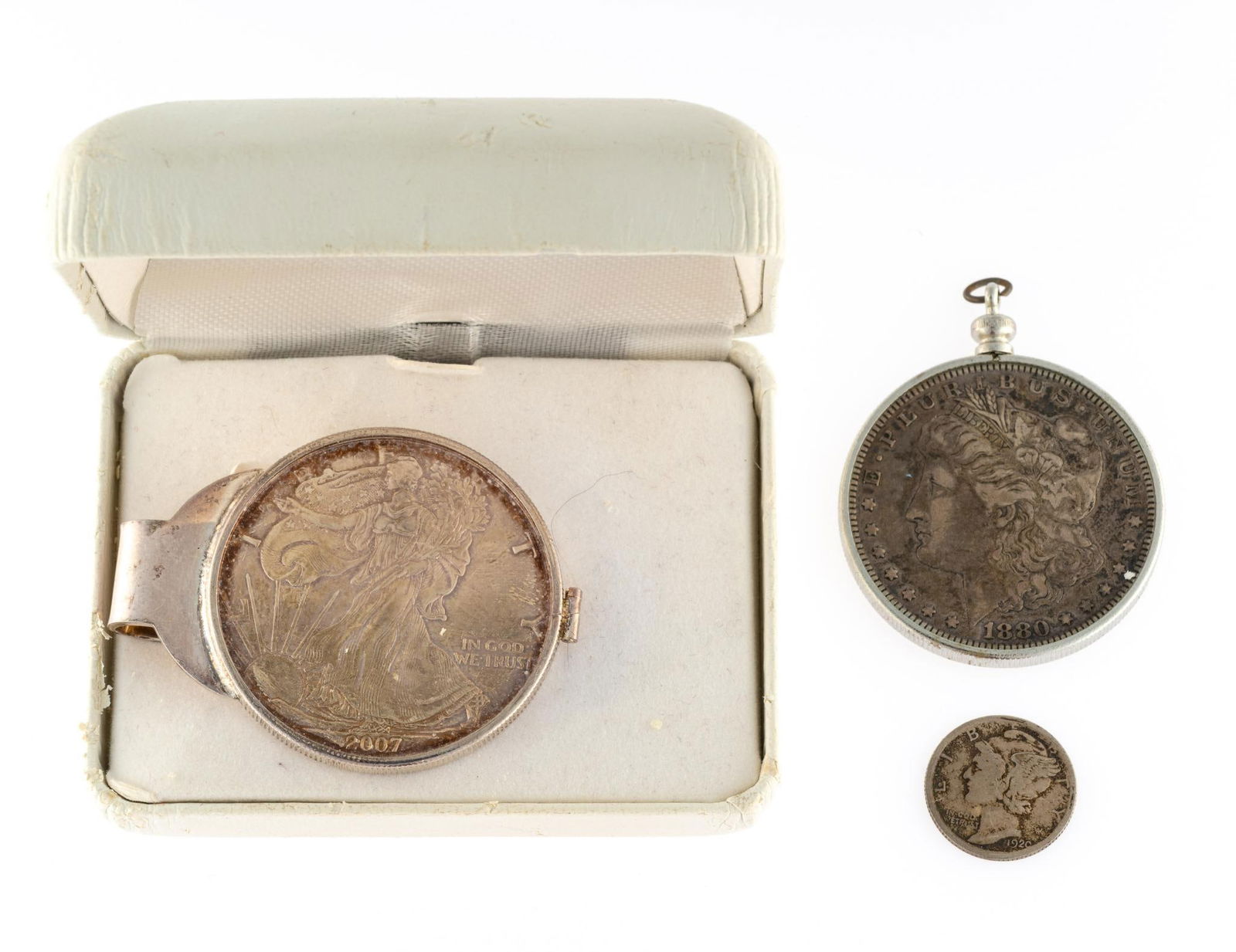 American Eagle Silver Coin Money Clip and Morgan Dollar Pendant: The money clip with a 2007 American Eagle one dollar coin weighs 45.7 grams. The 1880 Morgan dollar pendant is in a bezel that is apparently non-silver. Both bezels are mechanical allowing removal of