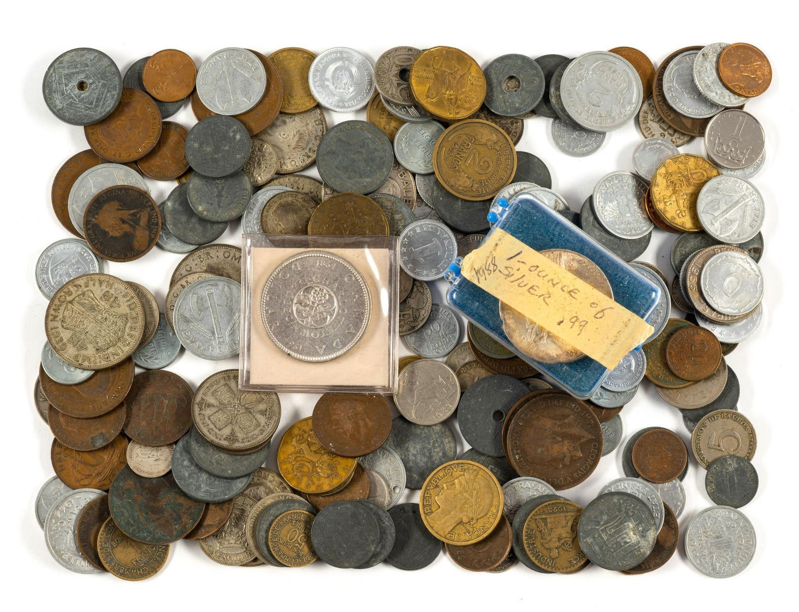 World Coins Including Silver: Various world coins. Silver coins include: (1) 1985 Mexico pure silver Libertad one ounce, uncirculated. (3) half crowns, (3) Florins, (2) shillings, (8) six pence, (3) three pence1930's and 1920's, 5