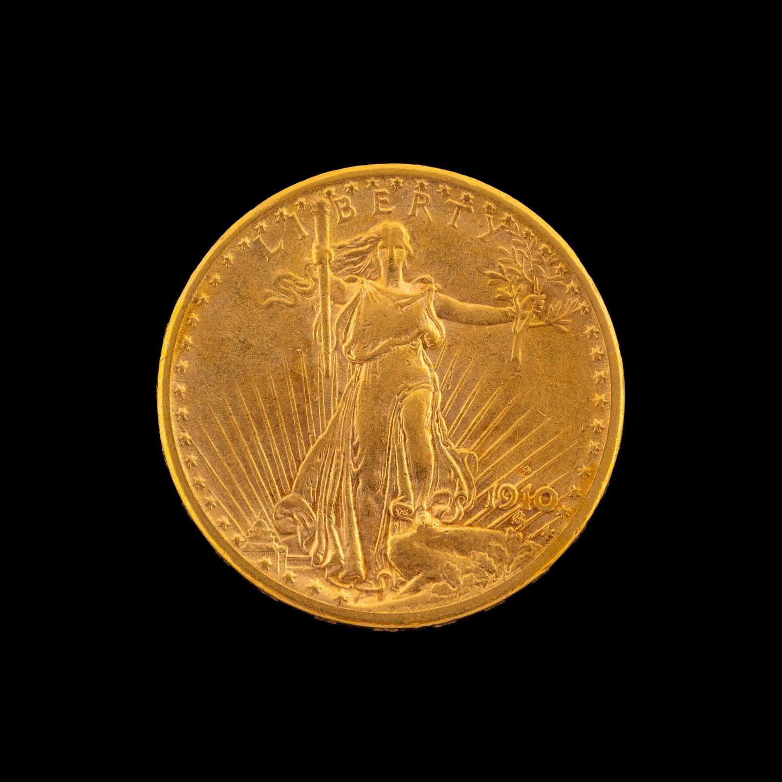 1910-S St. Gaudens $20 Gold Coin: XF to AU with mint luster and some hairlines from polishing.