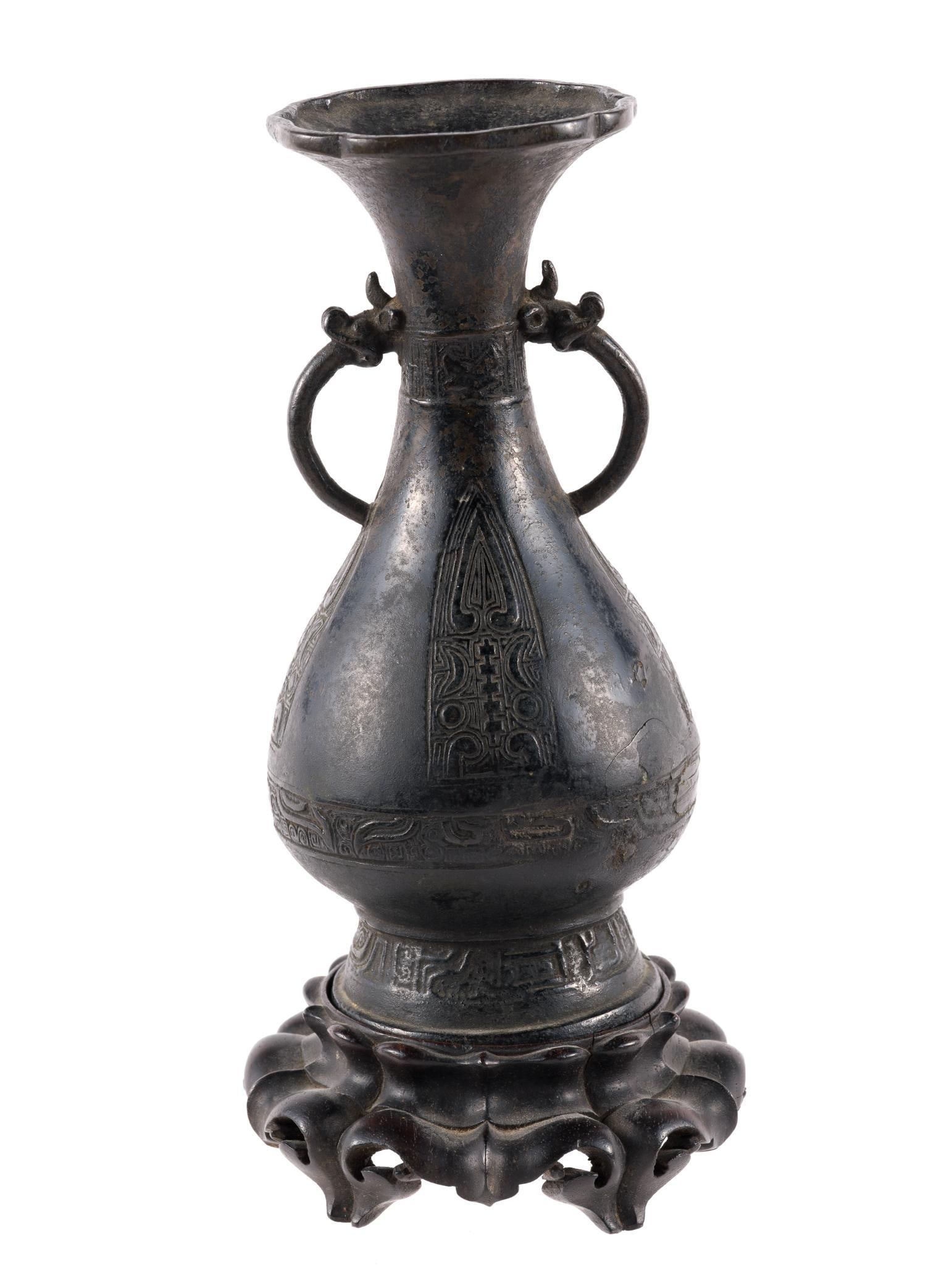 Chinese Ming Bronze Vase: With dragon head handles. Ming dynasty (1368-1644) was a powerful Chinese imperial dynasty that brought native Han rule after the Mongol Yuan Dynasty, known for economic and cultural growth, major con