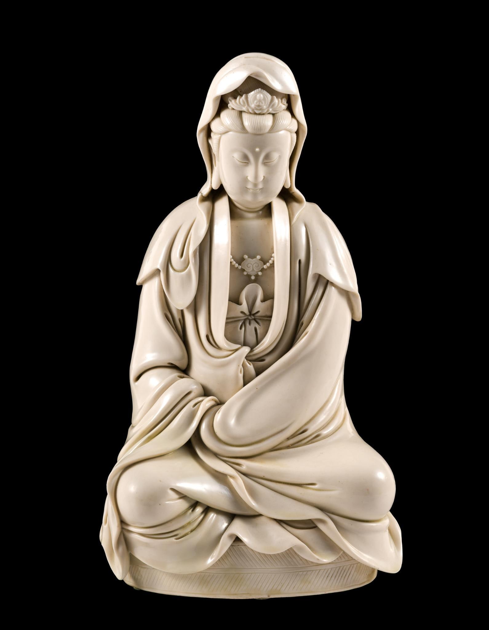 Ming Dynasty He Chaozong Guanyin Bodhisattva Statue: NOT ELIGIBLE FOR IN-HOUSE SHIPPING: See Terms for Shipping Options.Seated blanc de chine Guanyin Bodhisattva figure. He Chaozong mark on the back. He Chaozong was a celebrated early 17th century Chine