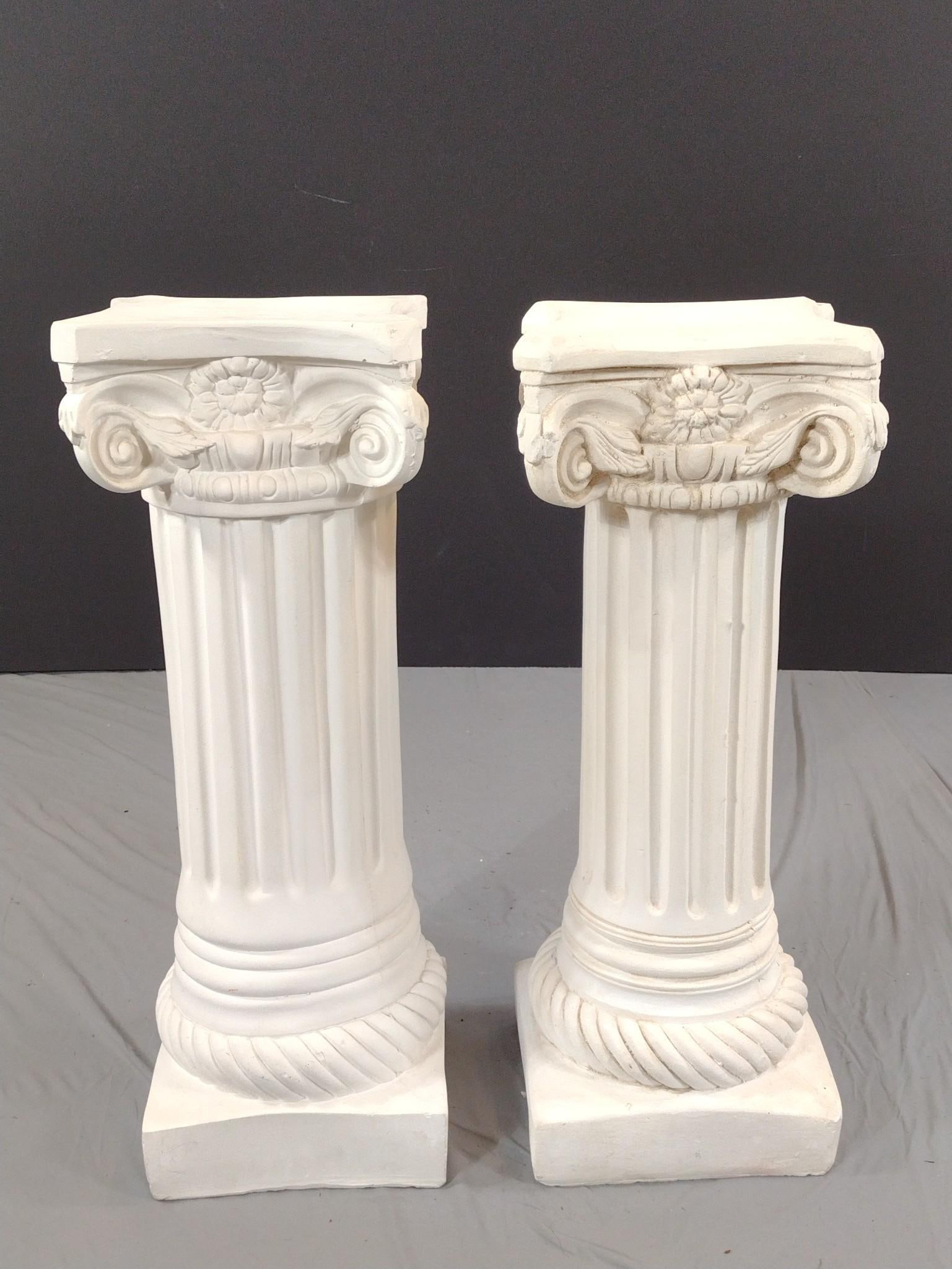 Pair Of Plaster Columns: NOT ELIGIBLE FOR IN-HOUSE SHIPPING: See Terms for Shipping Options. Each 10-1/2" wide X 10-1/2" deep X 28-3/4" high. Both have some small chips.