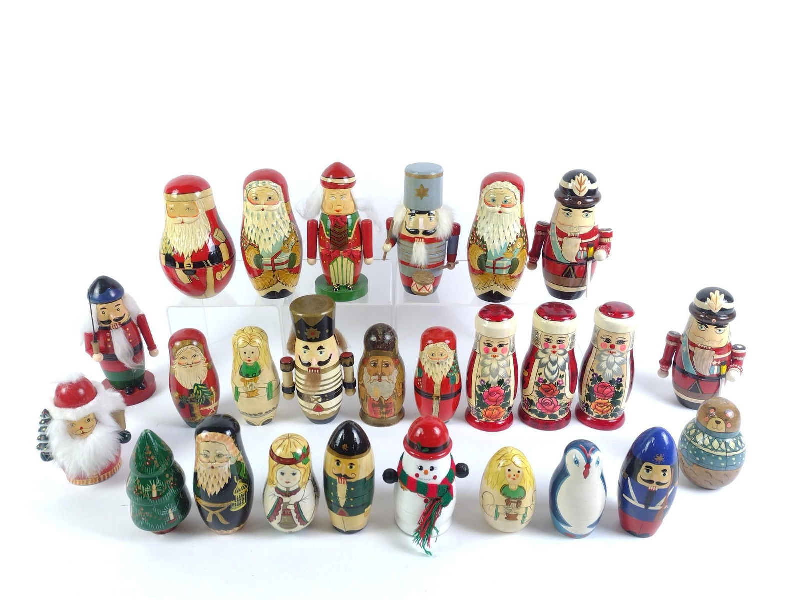 Large Lot of Russian & Chinese Nesting Dolls: Various motifs and themes. Some marked Made in Russia and some marked Made in China. Overall normal wear and tear associated with age. 4-1/2" to 7-1/2" tall overall.
