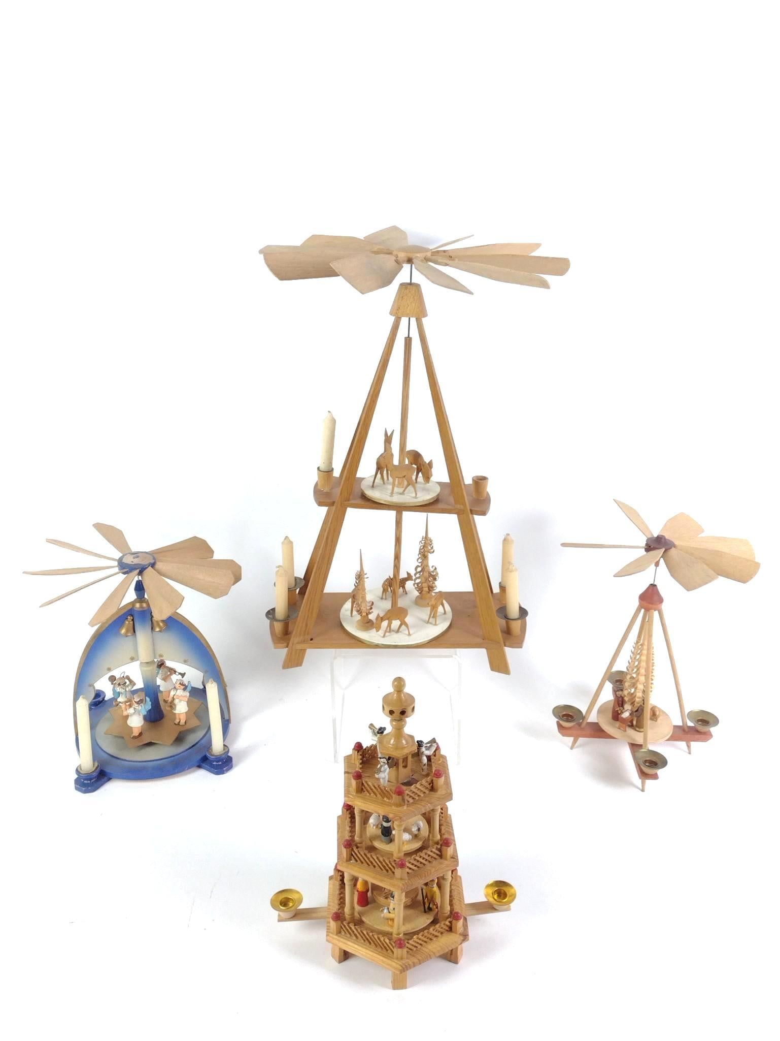 4 German Christmas Pyramids: 6" to 10-1/2" wide x 10-3/4" to 18-3/4" high. Some missing pieces.