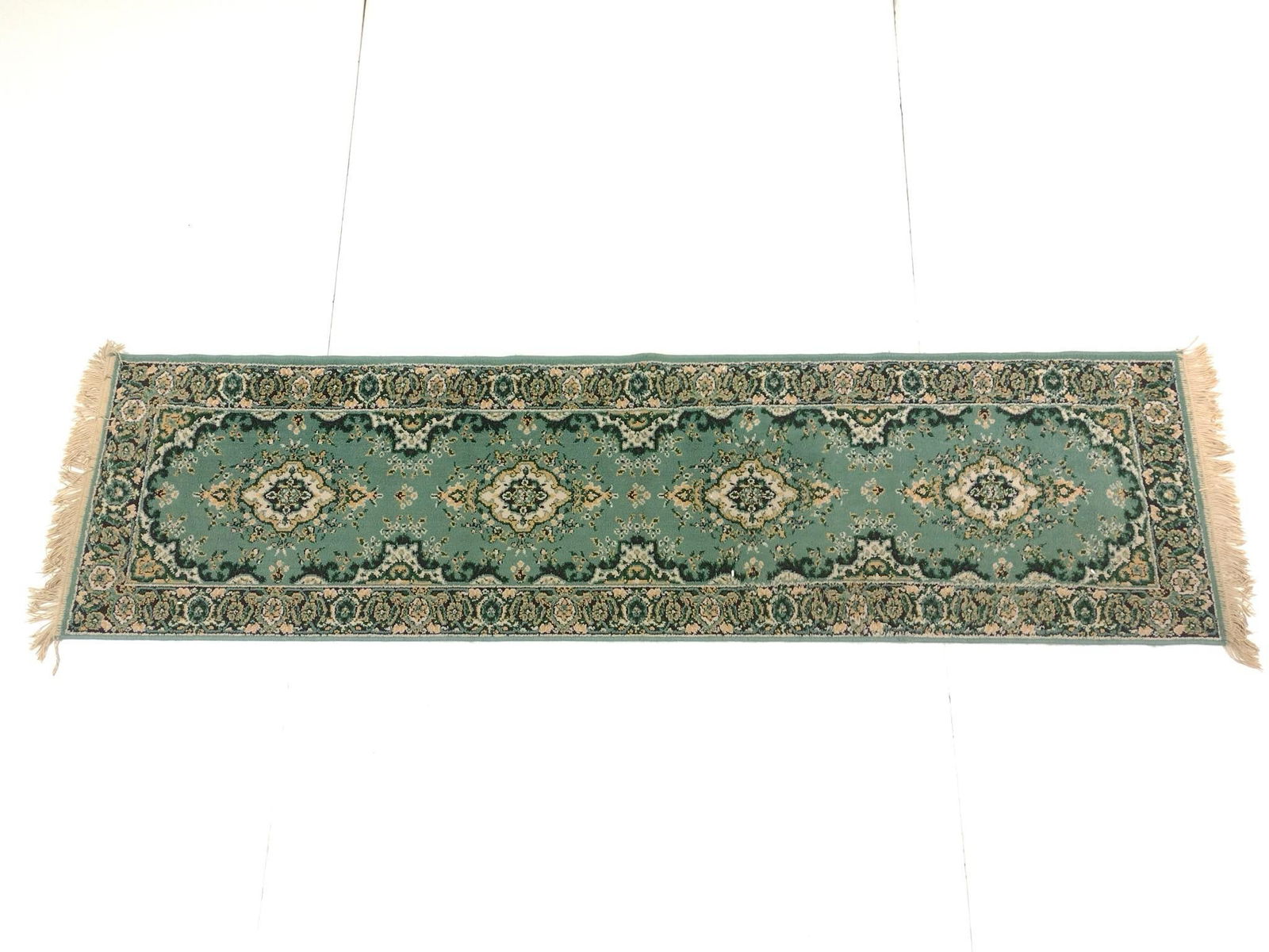 Kirman Style Runner: NOT ELIGIBLE FOR IN-HOUSE SHIPPING: See Terms for Shipping Options. Machine made. 23-1/2" wide x 86" long.