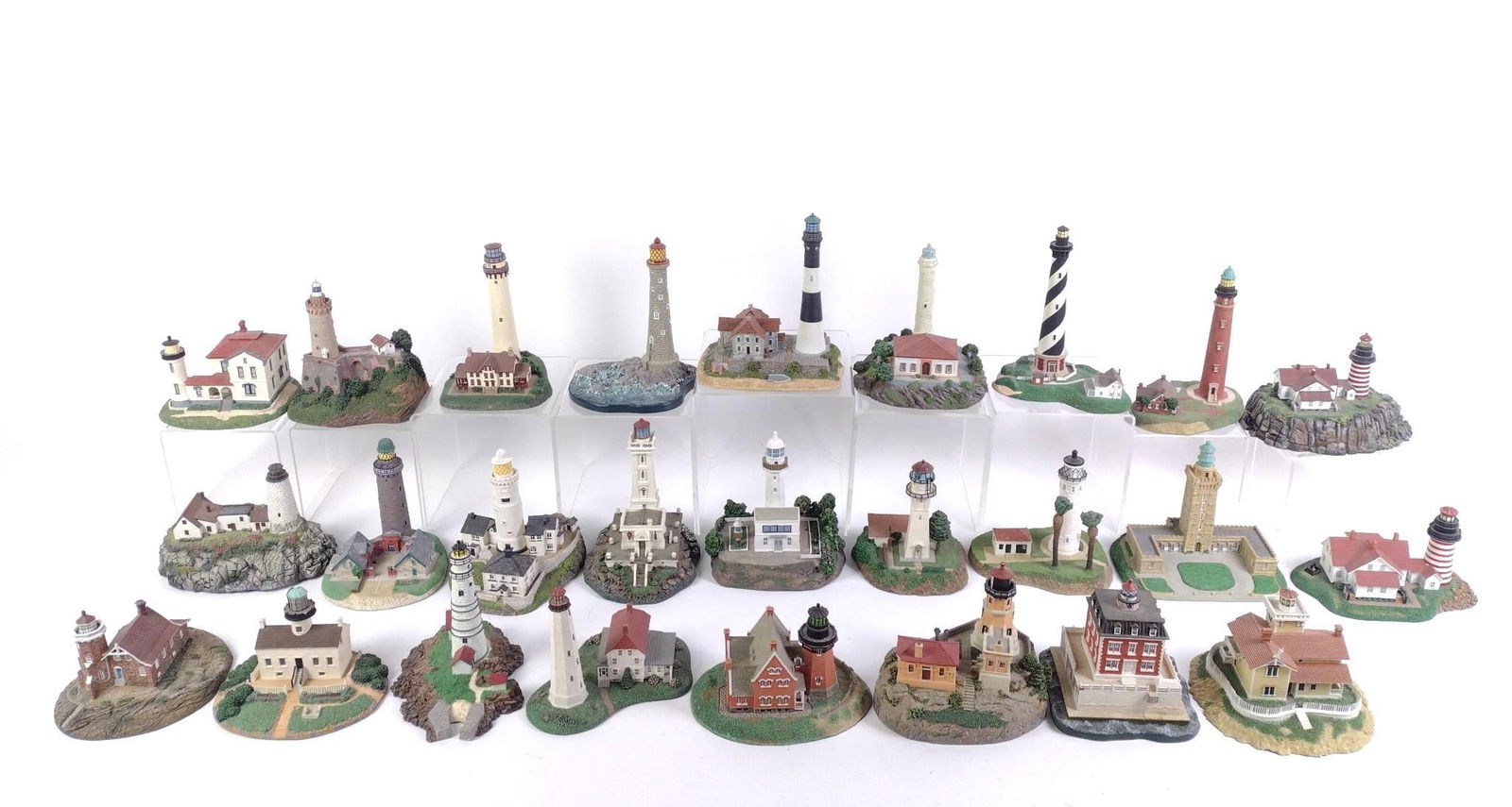 26 Model Lighthouses incl. Danbury Mint: Also includes COAs for some lighthouses. 6" to 6-1/4" wide x 3-1/2" to 7" high.