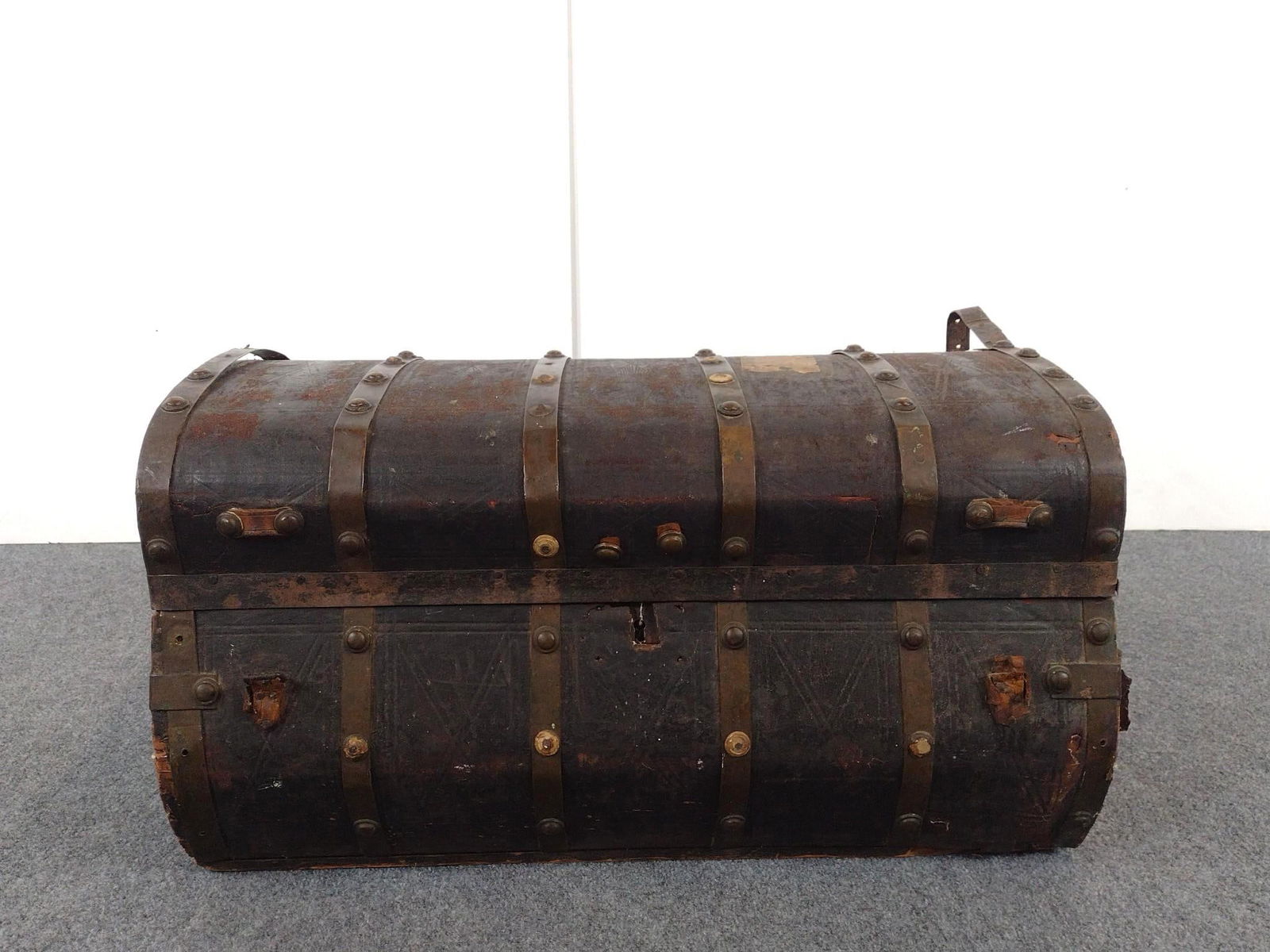 Antique Steamer Trunk: NOT ELIGIBLE FOR IN-HOUSE SHIPPING: See Terms for Shipping Options. 30" wide X 18" deep X 16-1/2" high. Has finish loss and wear.