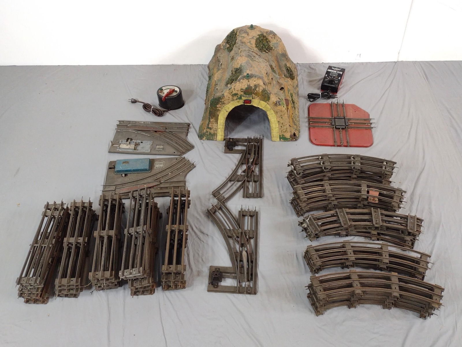 American Flyer Wide Gauge Track W/ Tunnel & Switches: Circa 1920s. Includes approx. 25 pieces of track with paper mache tunnel (with original metal plaque) & couple switches. Additionally includes two transformers. Untested. Tunnel has some holes from st