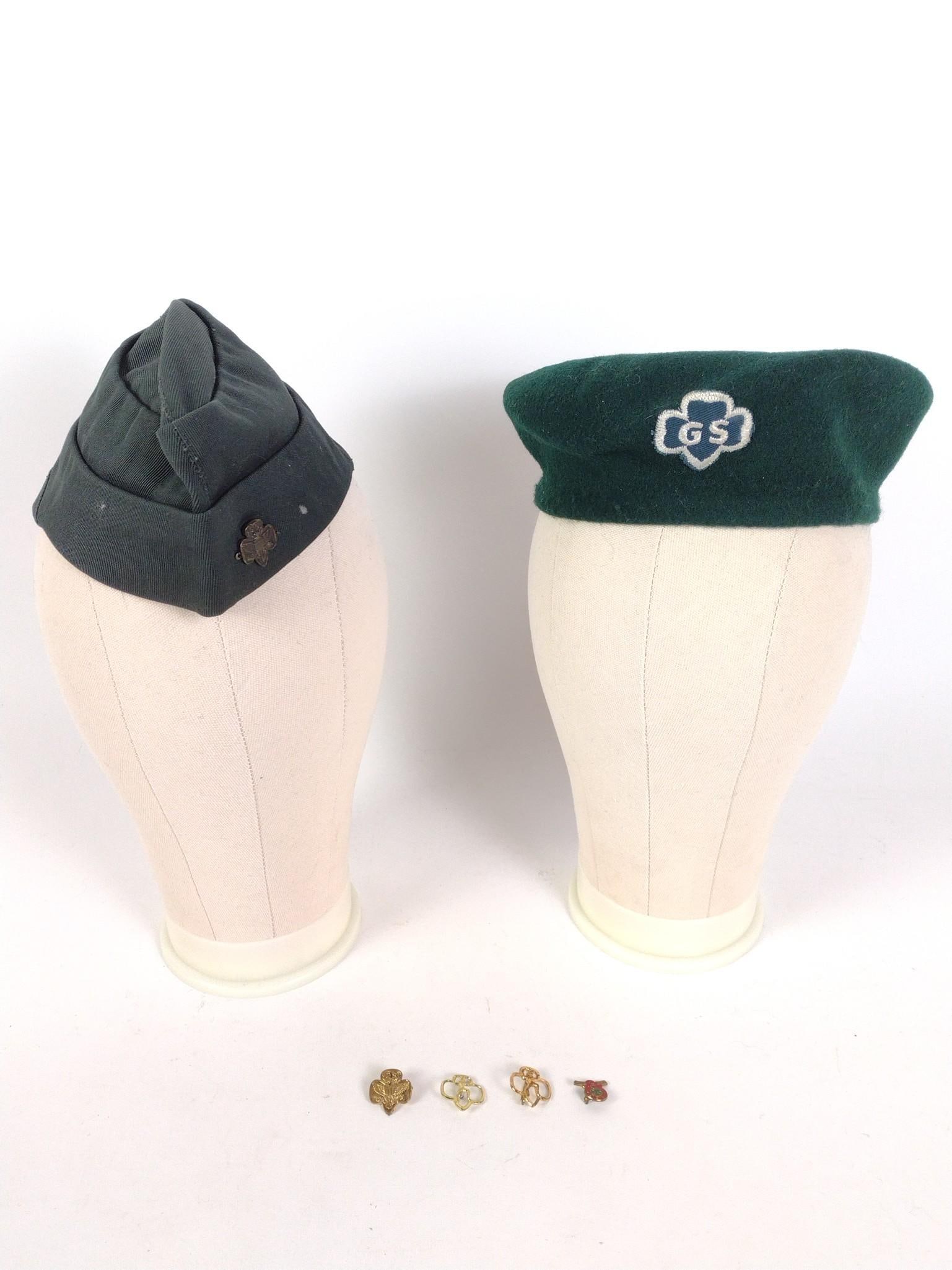 6 Girl Scout Items incl. Hats: Also includes pins. Hats both size 22. PROVENANCE: From the Estate of Virginia Parkum. The Rev. Dr. Virginia "Ginny" Cohn Parkum (1943-2025) was a Harrisburg resident dedicated to her art and serving