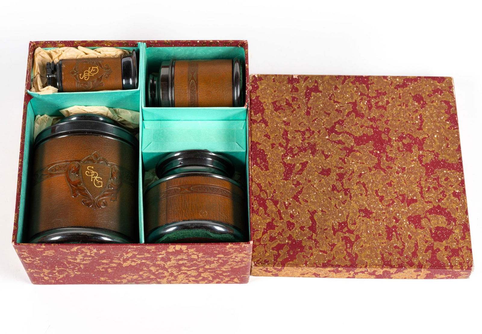 4 Pcs Male Grooming Set: Engraved with "SRG" From Remembrance Advertising. 2-1/4" to 4-1/2" wide x 3-1/2" to 6-1/2" high.