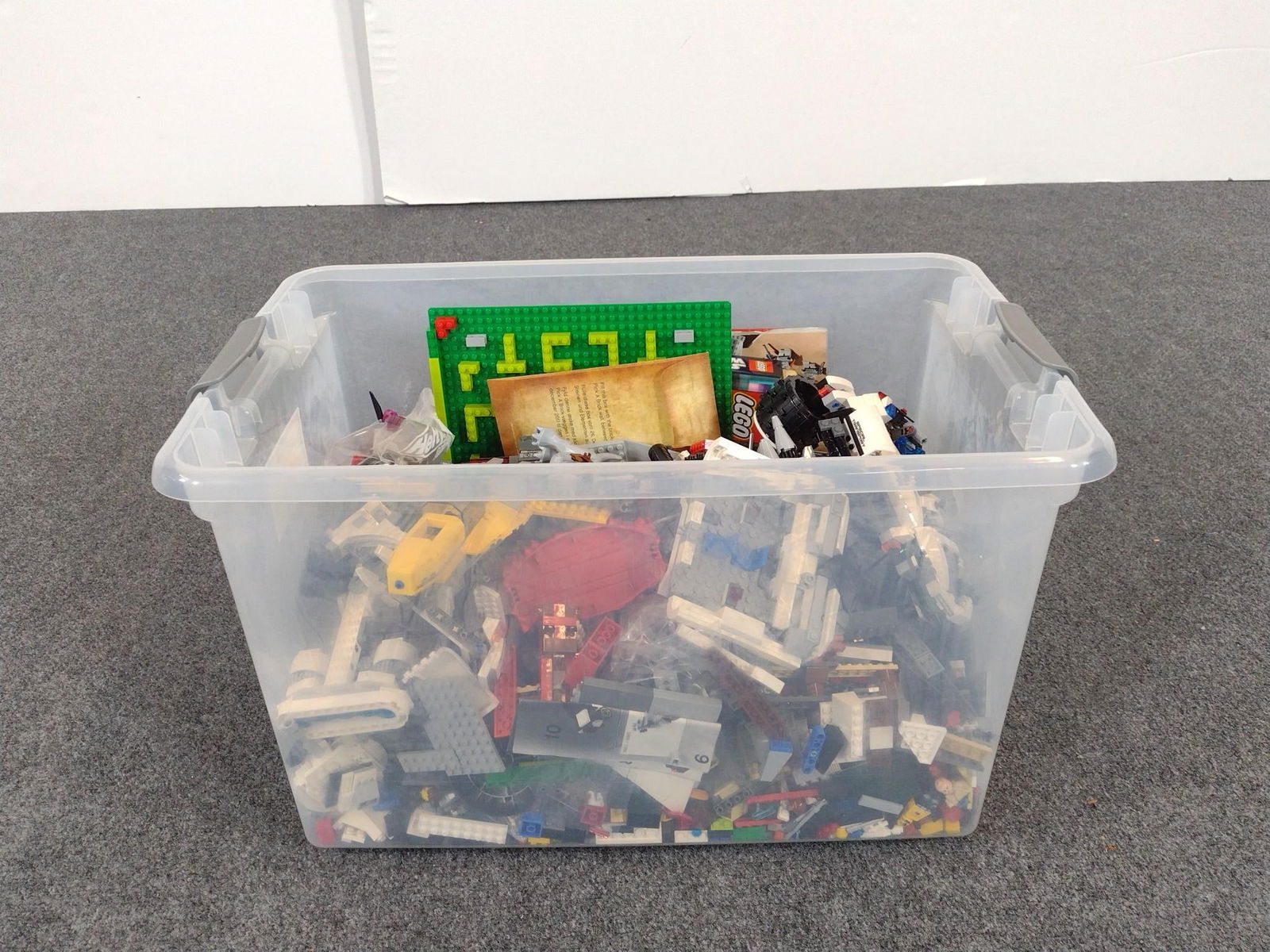 Large Collection of Legos Incl Star Wars: Collection of loose Legos with mini figures (or figs), with Star Wars and Lego City (plane, police car), and more. Unknown if complete sets. Comes with some instruction booklets (unconfirmed with sets