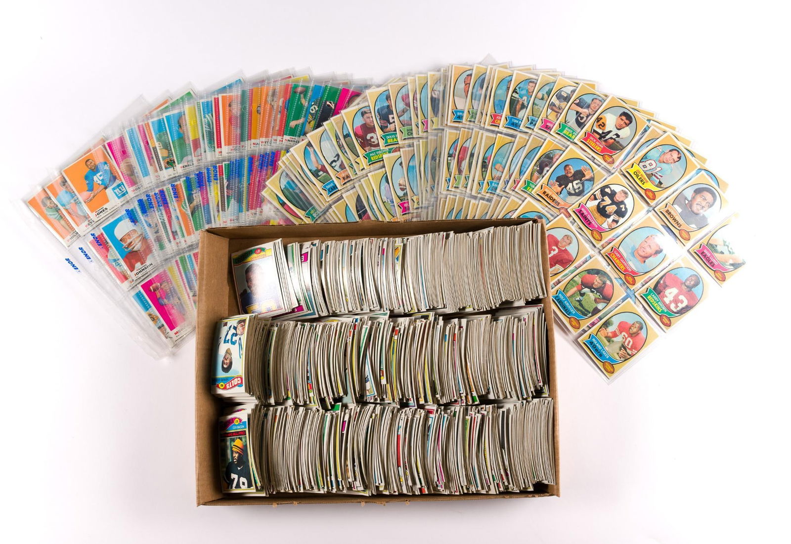 Large Collection of 1970s Topps Football Cards: Includes team such as Colts, Chiefs, Green Bay Packers, Dallas Cowboys, and so much more. Slight mildew odor due to long term storage, and a couple cards have pieces missing.