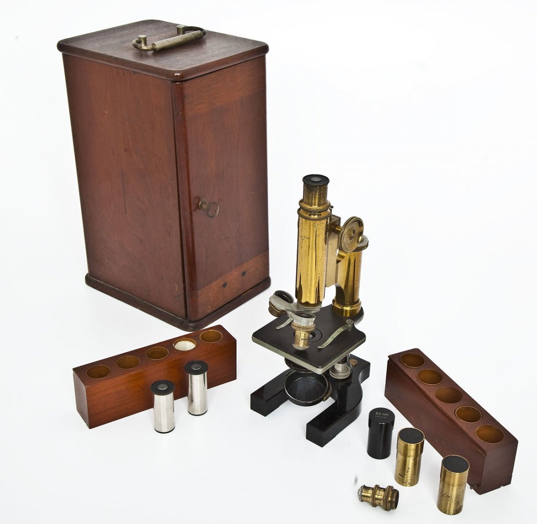 Bausch & Lomb Optical Co. Microscope in Case: DESCRIPTION: Bausch & Lomb Optical Company brass microscope in its original fitted wood case with two compartments containing five lenses. Circa early 20th century. Marked "Bausch & Lomb Optical Co. R
