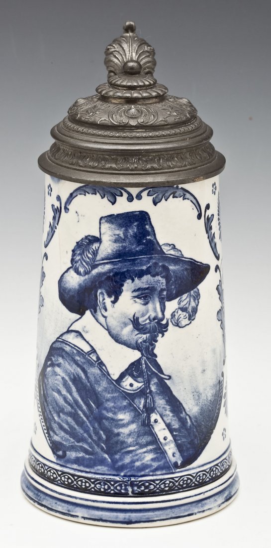 Royal Bonn Delft Franz A. Mehlem Porcelain Stein: DESCRIPTION: Royal Bonn Delft Franz Anton Mehlem porcelain stein depicting a 3/4 portrait of a man with a feather in his hat surrounded by a decorative floral design. With a pewter lid and thumb lift.