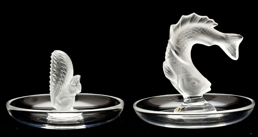 2 Lalique France Glass Figural Ring Trays: DESCRIPTION: Two Lalique France glass ring trays with one depicting a squirrel and the other a fish in frosted glass with a clear glass base. Each signed "Lalique France," on the bottom. MEASUREMENTS: