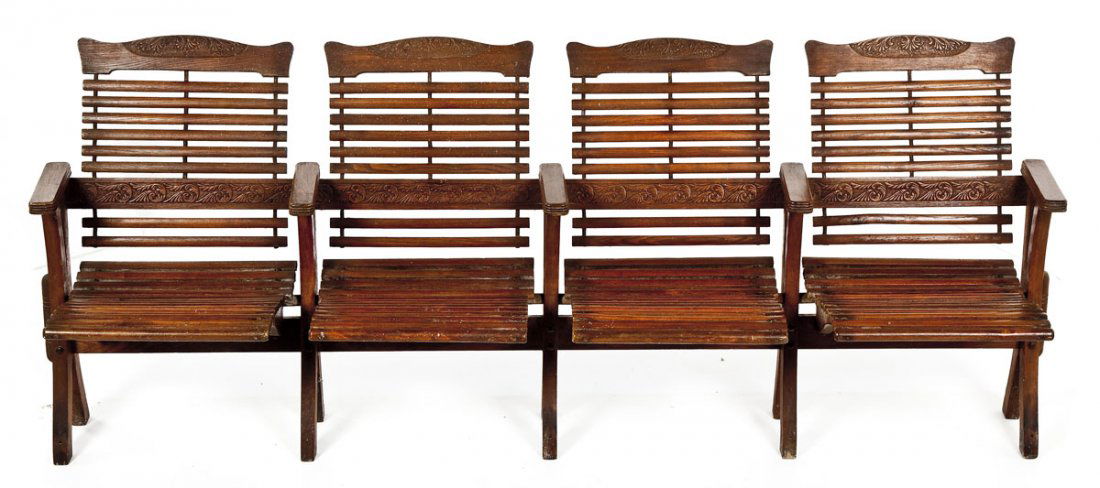 Four Seat Bus Station Bench from Baltimore: DESCRIPTION: Four seat bus station bench of oak with decorative pressed crests and back splats and cast iron hardware. Late 19th/early 20th century. PROVENANCE: Per the consignor, from a Baltimore bus