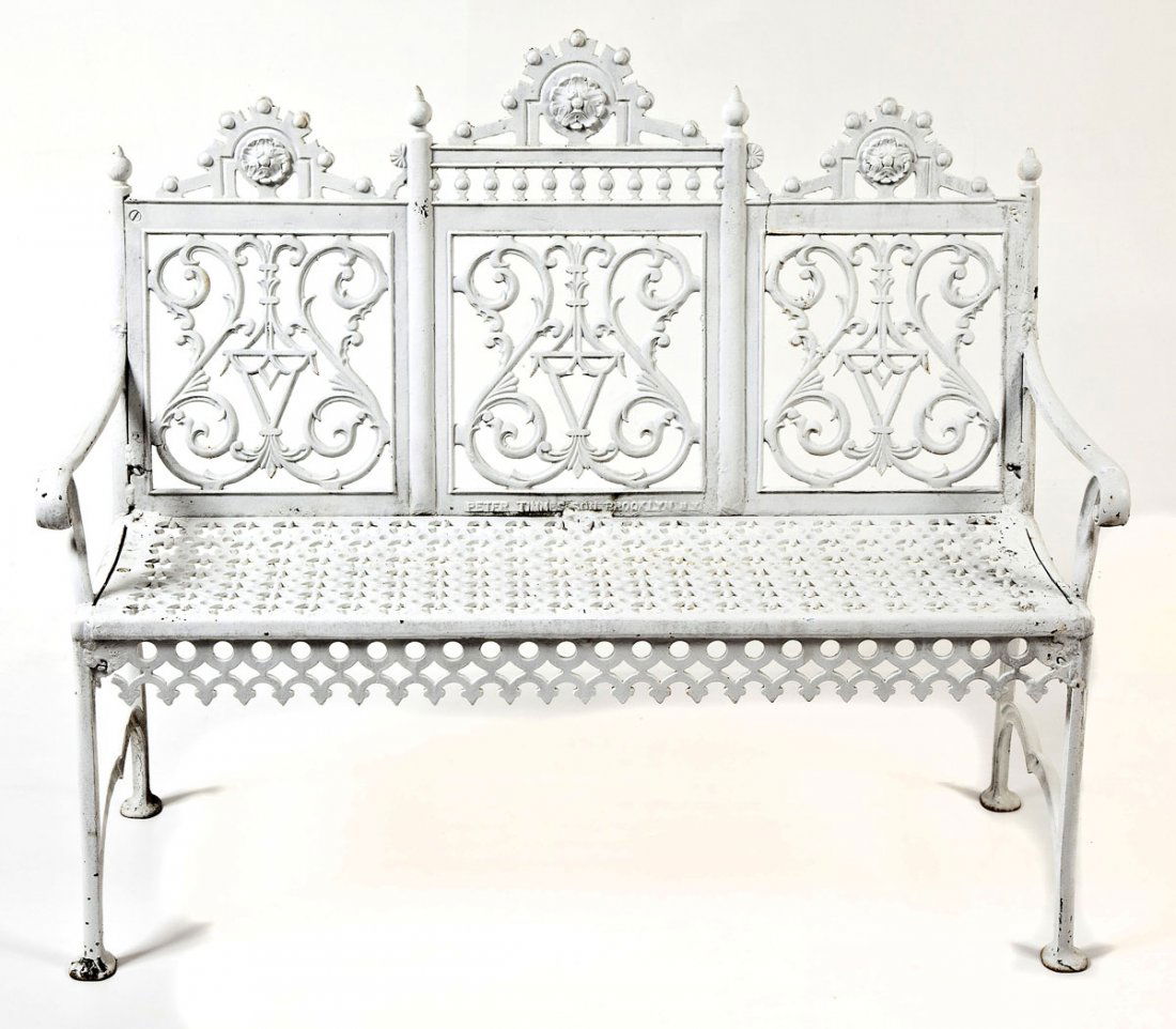 Victorian Peter Timmes Cast Iron Patio Bench: DESCRIPTION: Victorian white painted cast iron patio bench by Peter Timmes having tripartite scroll paneled back with rosette and finial crest, geometric pierced seat and seat rail, scrolled arms, and