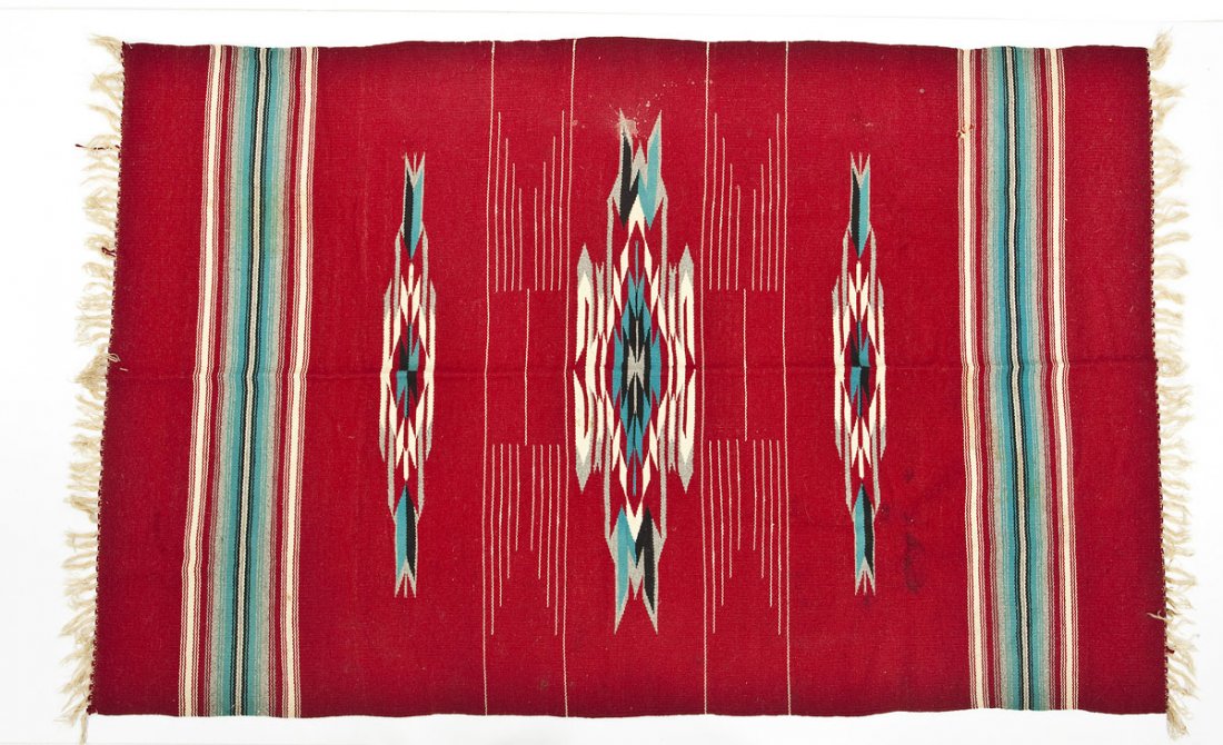 Mexican Red Saltillo Blanket: DESCRIPTION: Mexican Saltillo blanket, probably Chimayo, with a blue, white, gray, and black geometric design on a red ground. MEASUREMENTS: 70-1/4" x 45". CONDITION: A few small scattered stains and 