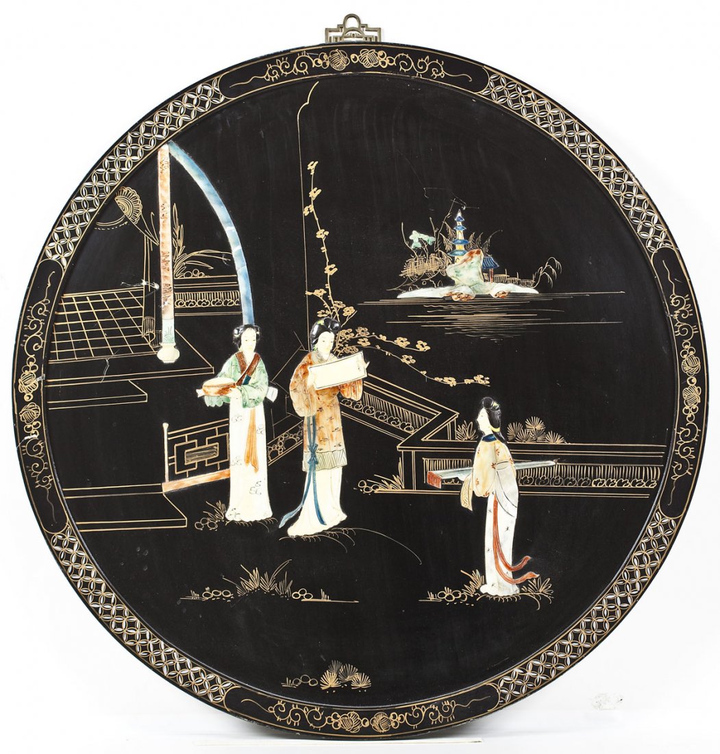 Chinese Lacquer & Soapstone Wall Panel: DESCRIPTION: Chinese black lacquered wood wall panel with gilt decoration and applied colored soapstone depicting three women in a landscape. With a brass hanger at the top. With label verso marked "M