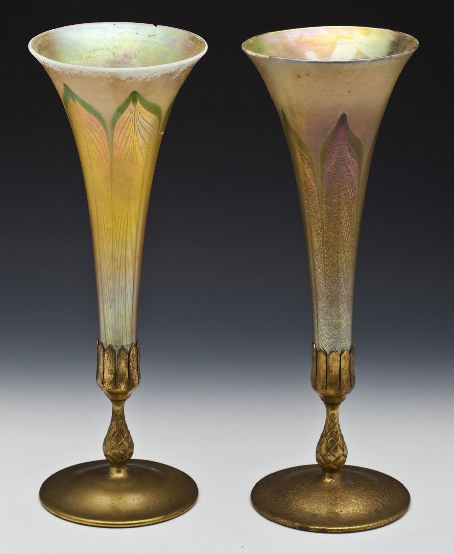 Pair of Tiffany Studios Favrile Trumpet Vases: DESCRIPTION: Pair of Tiffany Studios trumpet vases of pulled feather gold favrile glass. Dore bronze bases, one textured and one smooth, with a pineapple shaped stem. Each vase marked "L.C.T.," on the