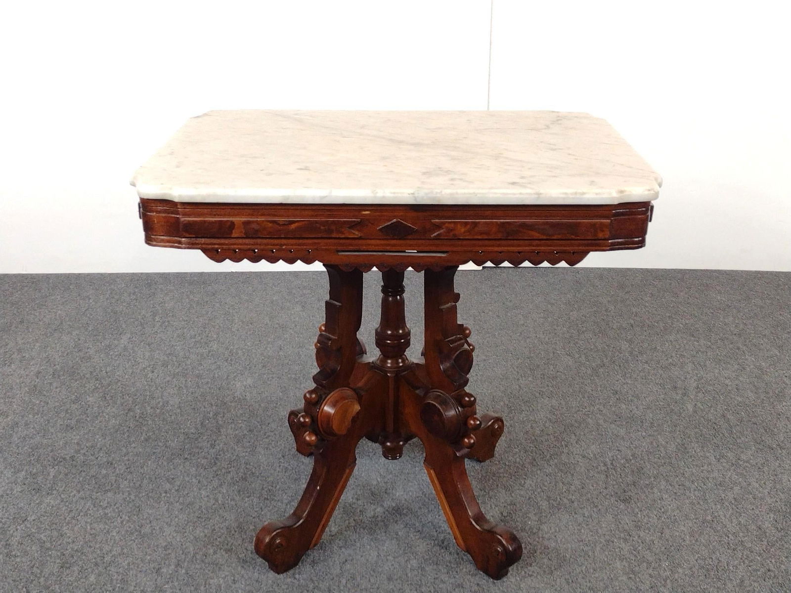 Antique Victorian Eastlake Style Marble Top Table: NOT ELIGIBLE FOR IN-HOUSE SHIPPING: See Terms for Shipping Options. 31" wide X 22" deep X 28-1/4" high.