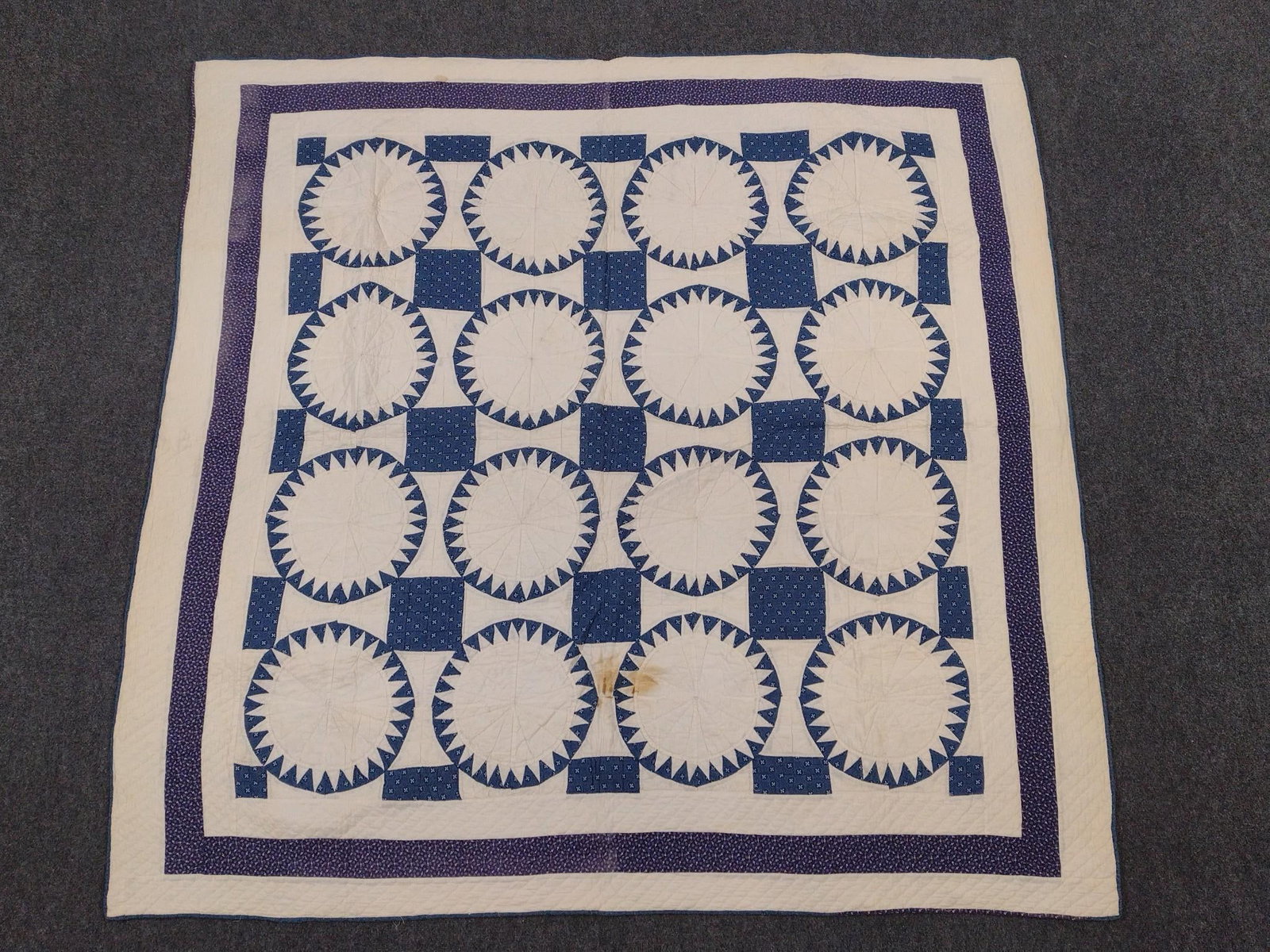 Vintage Blue and White Quilt: 6' wide X 6' long. Some staining.
