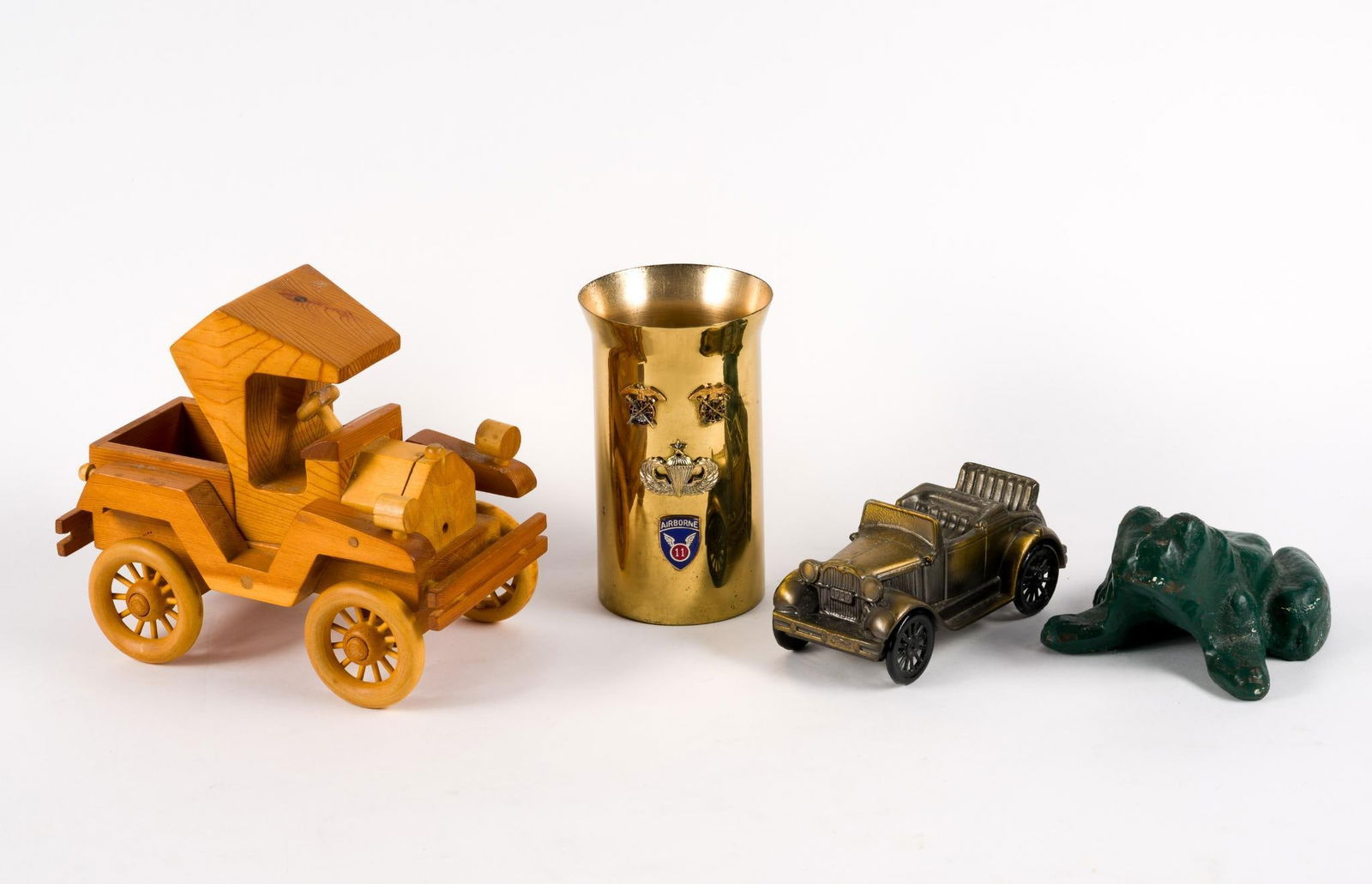Collectibles Incl Cast Iron Frog: Also includes wood and brass truck, military base. 2-1/2" to 6" high.