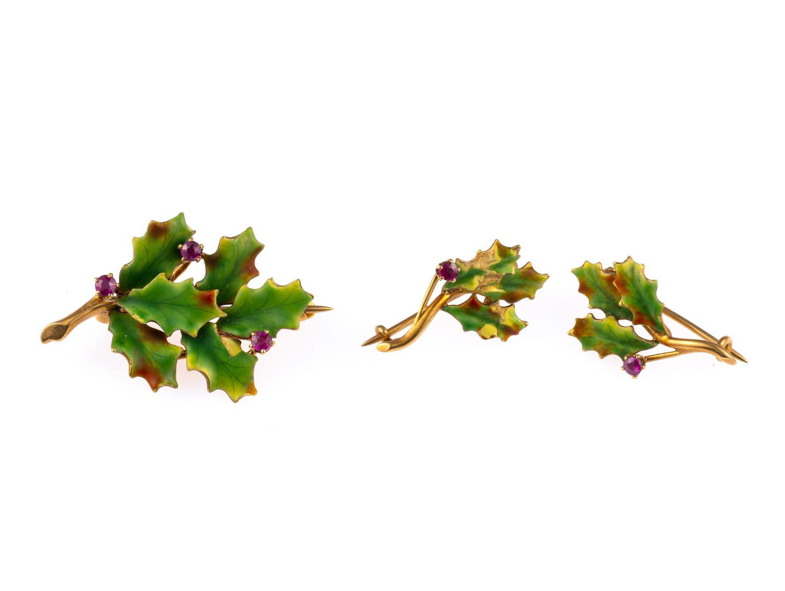 Victorian 14K Gold Holly Branch Brooch and Pins: The pins and brooch are in 14k rose gold with enamel work to the tops and adorned with prong-set ruby berries. Largest is 1 1/8". Total weight is 6.8 grams.