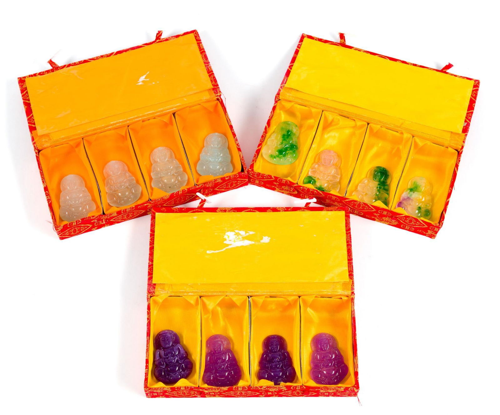 12 Carved Ice Jade Buddha Guanyin Figurines in Cases: Buddhas measure 1-1/2" wide x 2" long. Boxes measure 7-1/2" wide x 1-1/4" high.