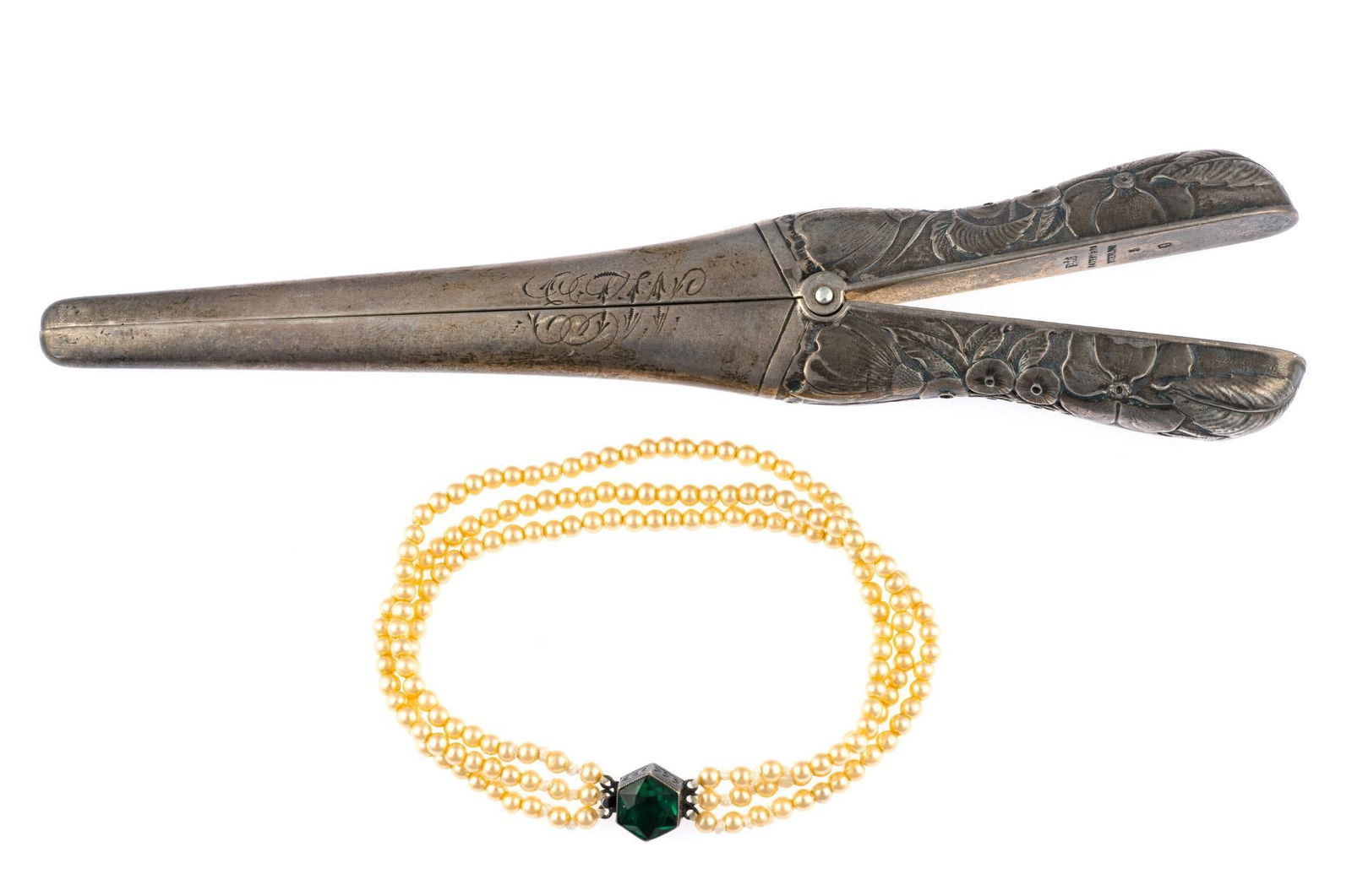 Antique Sterling Silver Glove Stretcher and Pearl Bracelet: 6 1/2" length glove stretcher, 2.2 troy ounces. Antique three strand pearl bracelet with silver ends.