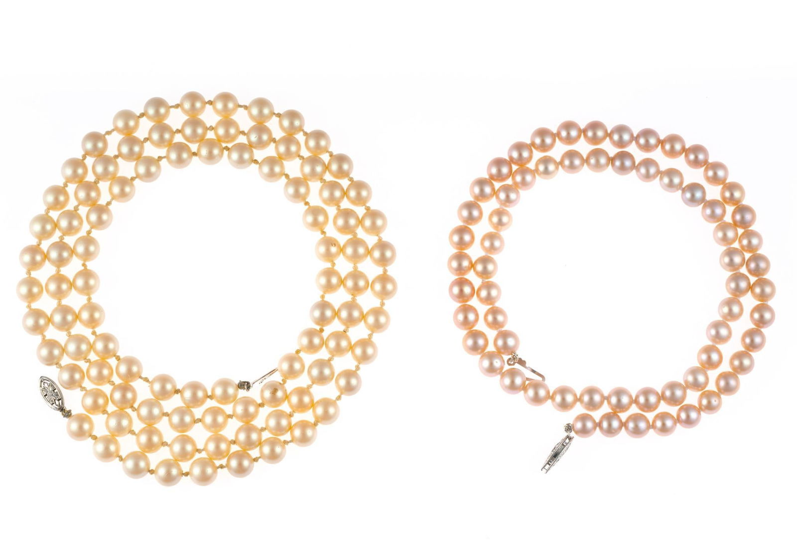 Two Pearl Necklaces 14K Gold and Platinum Clasps: One 18" with pink 6.75 mm pearls and a white clasp testing platinum. The second 32" length with 7 mm pearls and a 14k yellow gold clasp.
