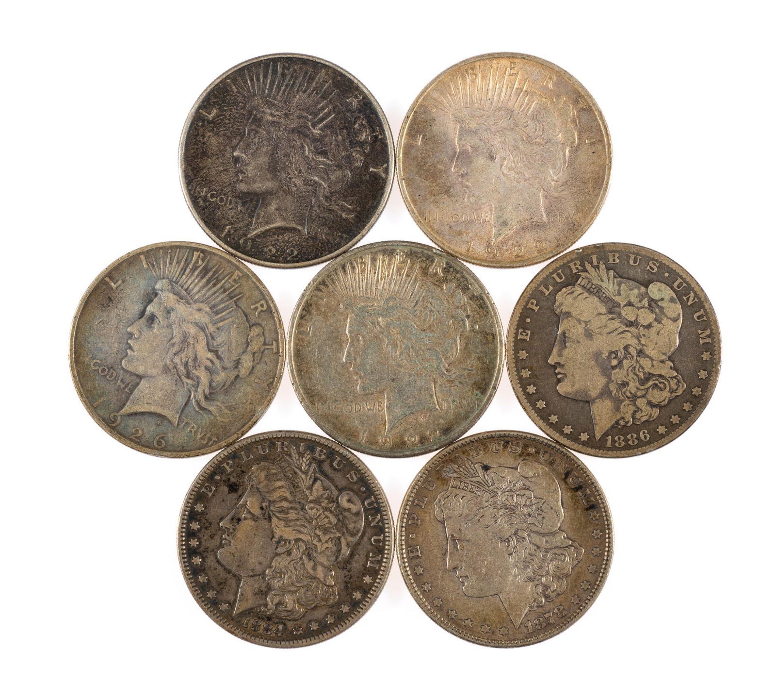 Seven Morgan And Peace Silver Dollars: Morgan and Peace dollars all in circulated condition with good surfaces, no signs of past polishing.